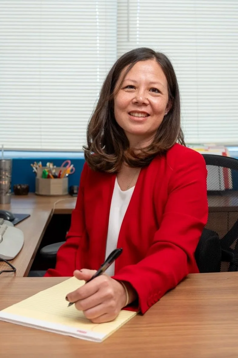 Photo of Jinah at her office