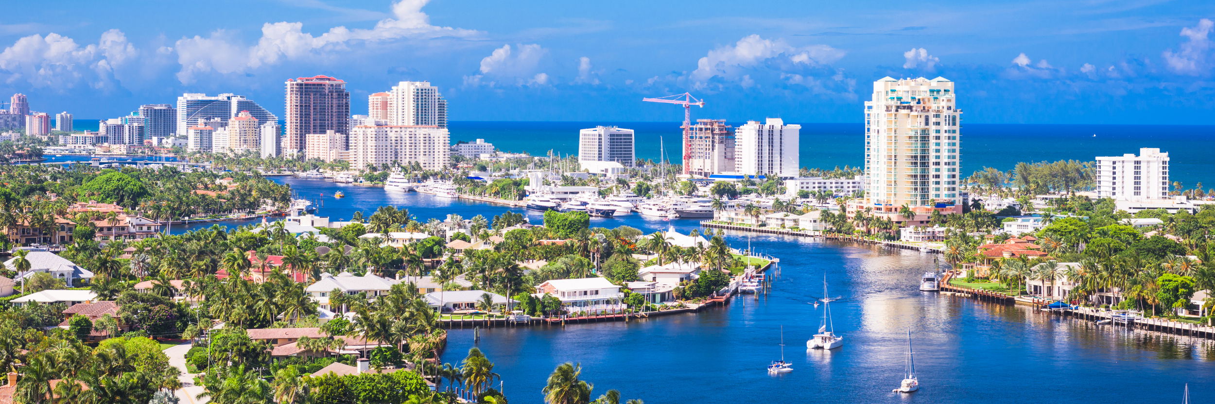 A beautiful picture of a beach and houses representing South Florida