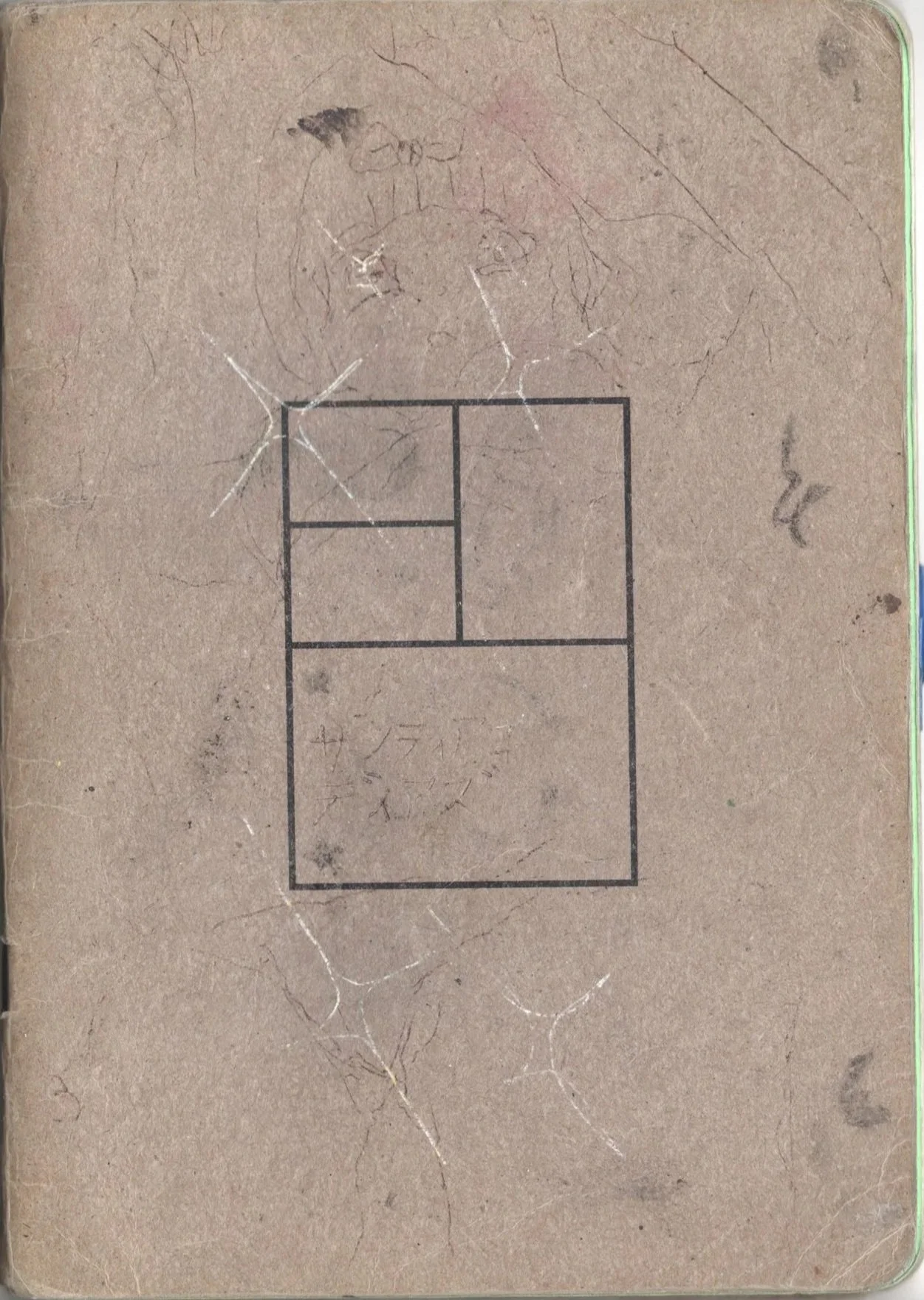 Cuaderno de color marrón con dibujo de un gato en la parte superior y una figura de esquema con cuadrados y líneas en la parte central.