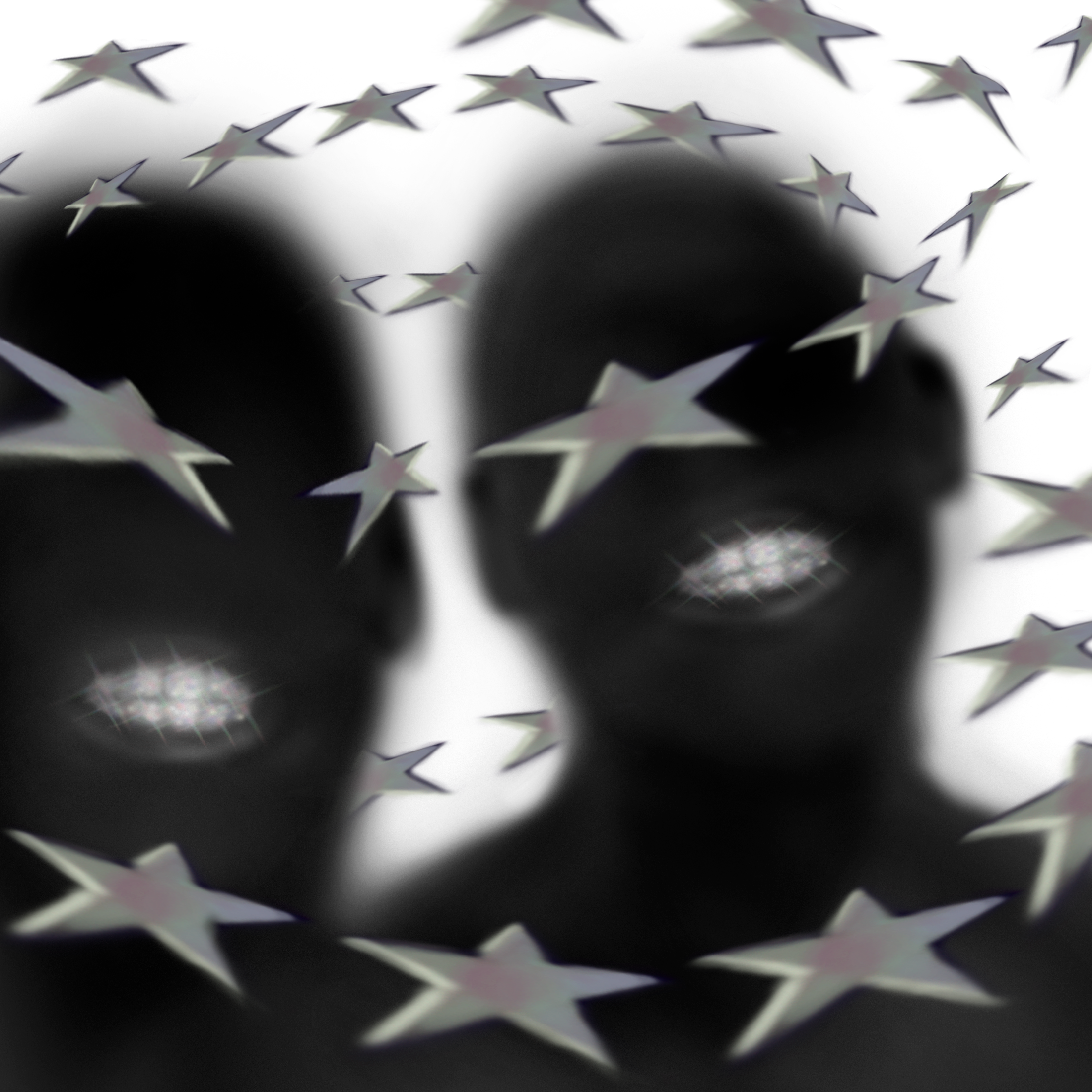 Vista en primer plano de chocolates con forma de cilindro y decorados con estrellas metálicas.