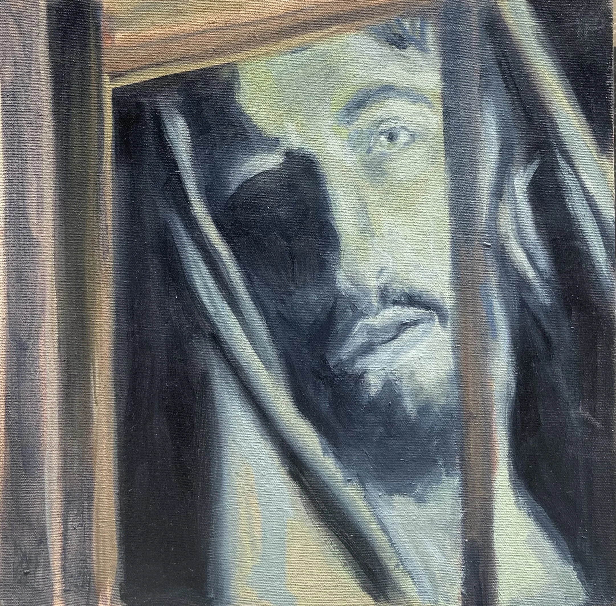 Retrato de Jesucristo con una corona de espinas, enmarcado por una estructura de madera.