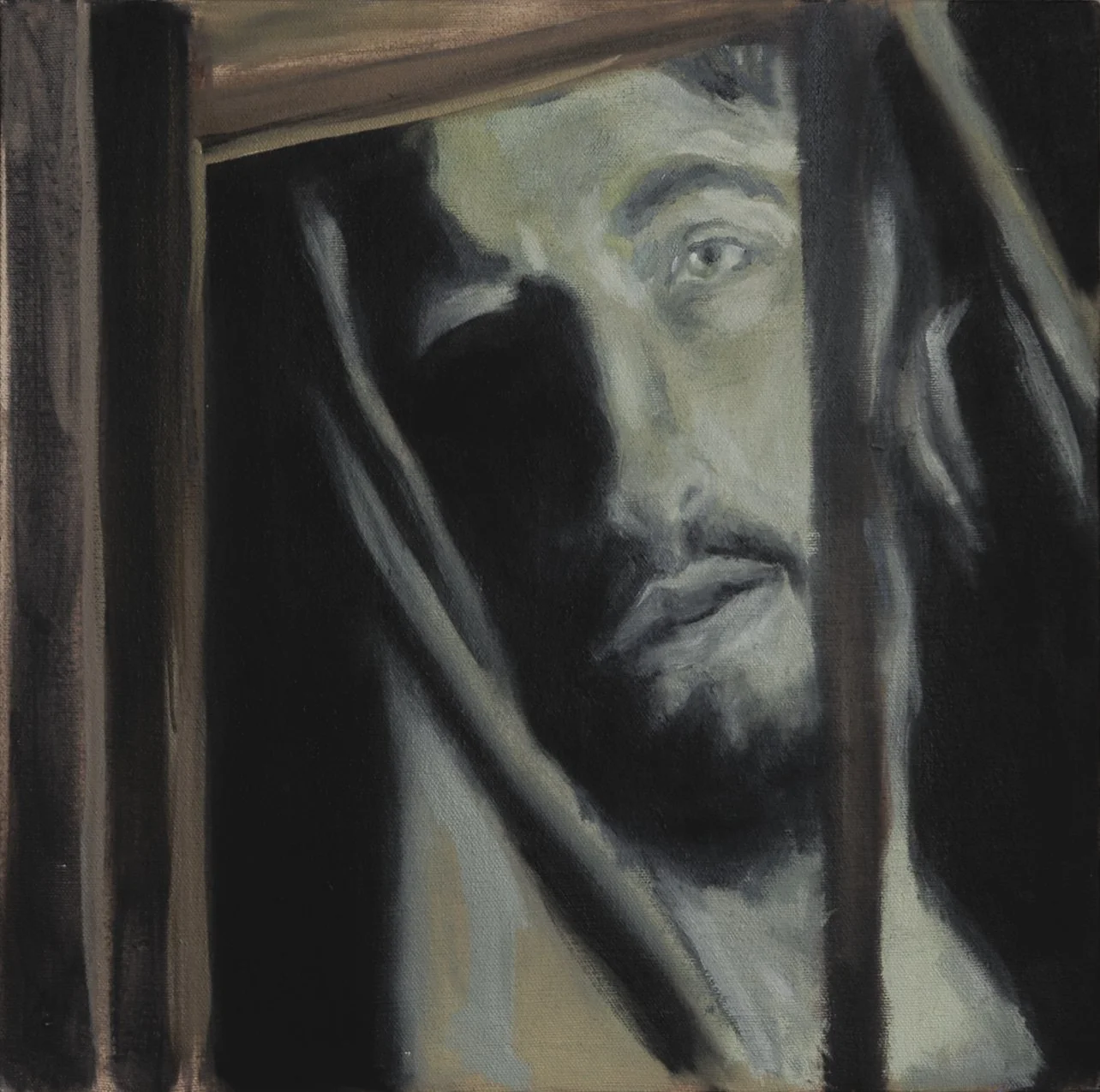 Retrato en tonos oscuros de Jesucristo con barba y cabello largo. La imagen transmite una expresión solemne y piadosa.