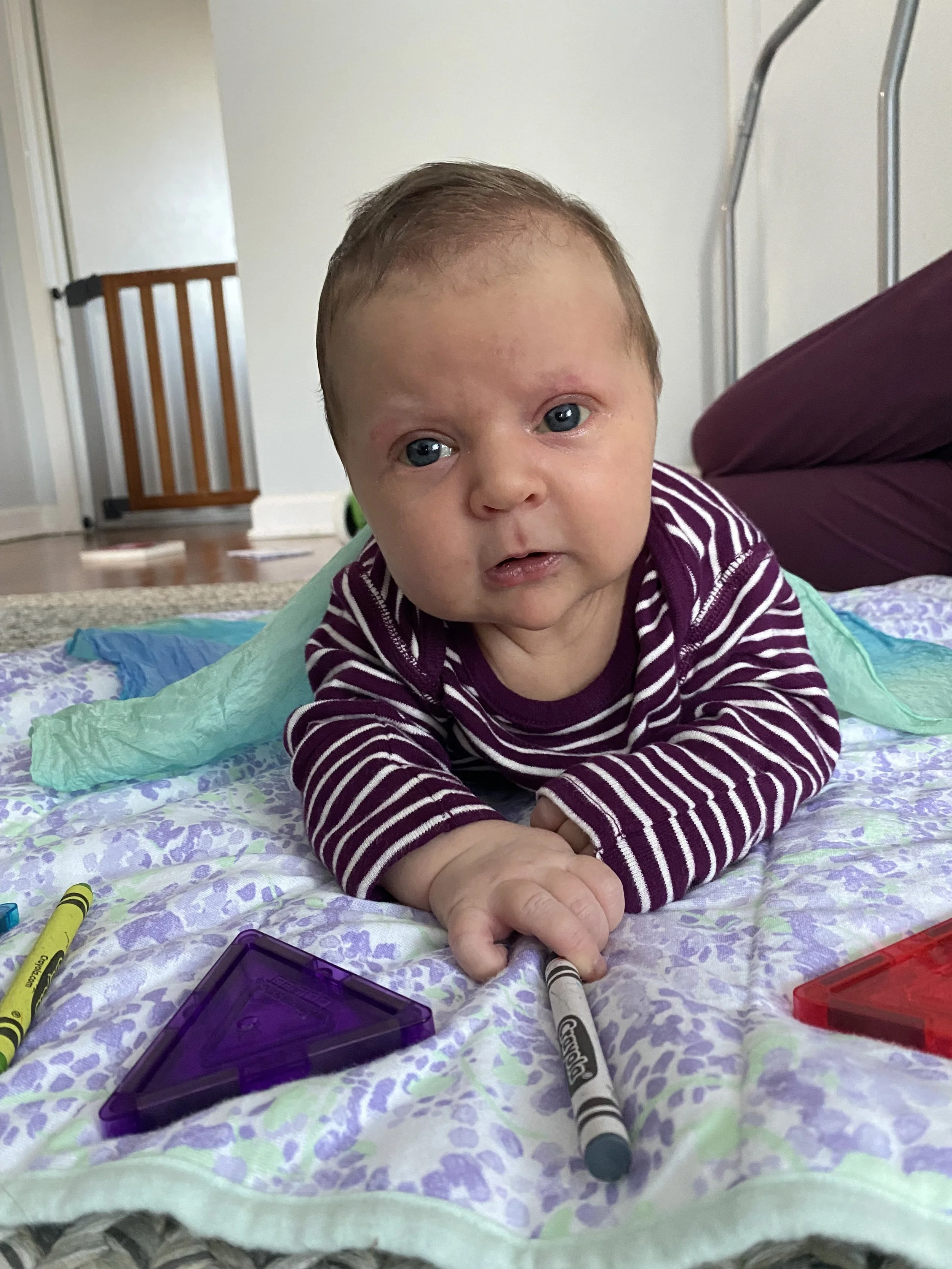 baby on blanket with head up in tummy time