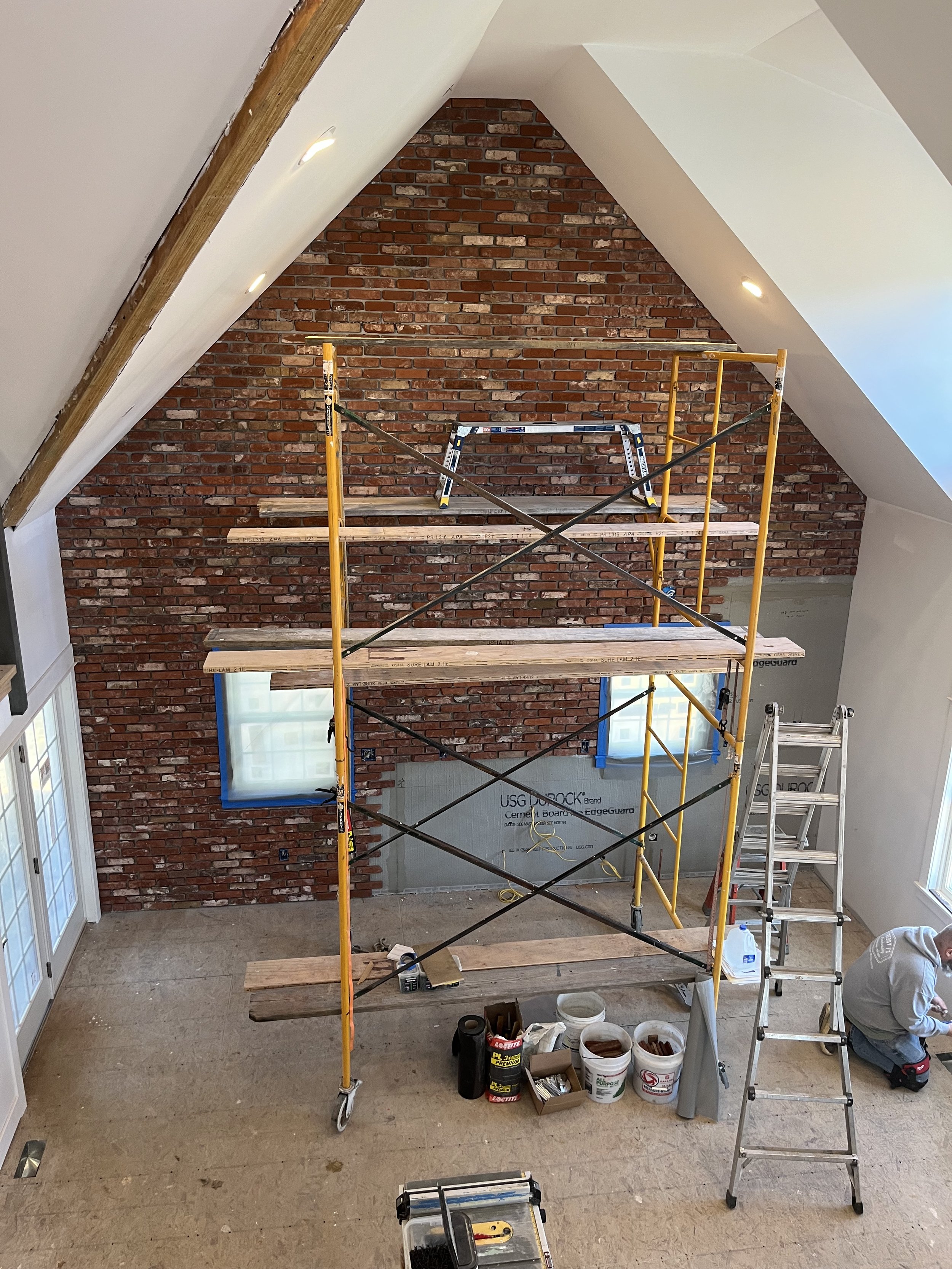 large int brick wall fireplace to be built.jpeg