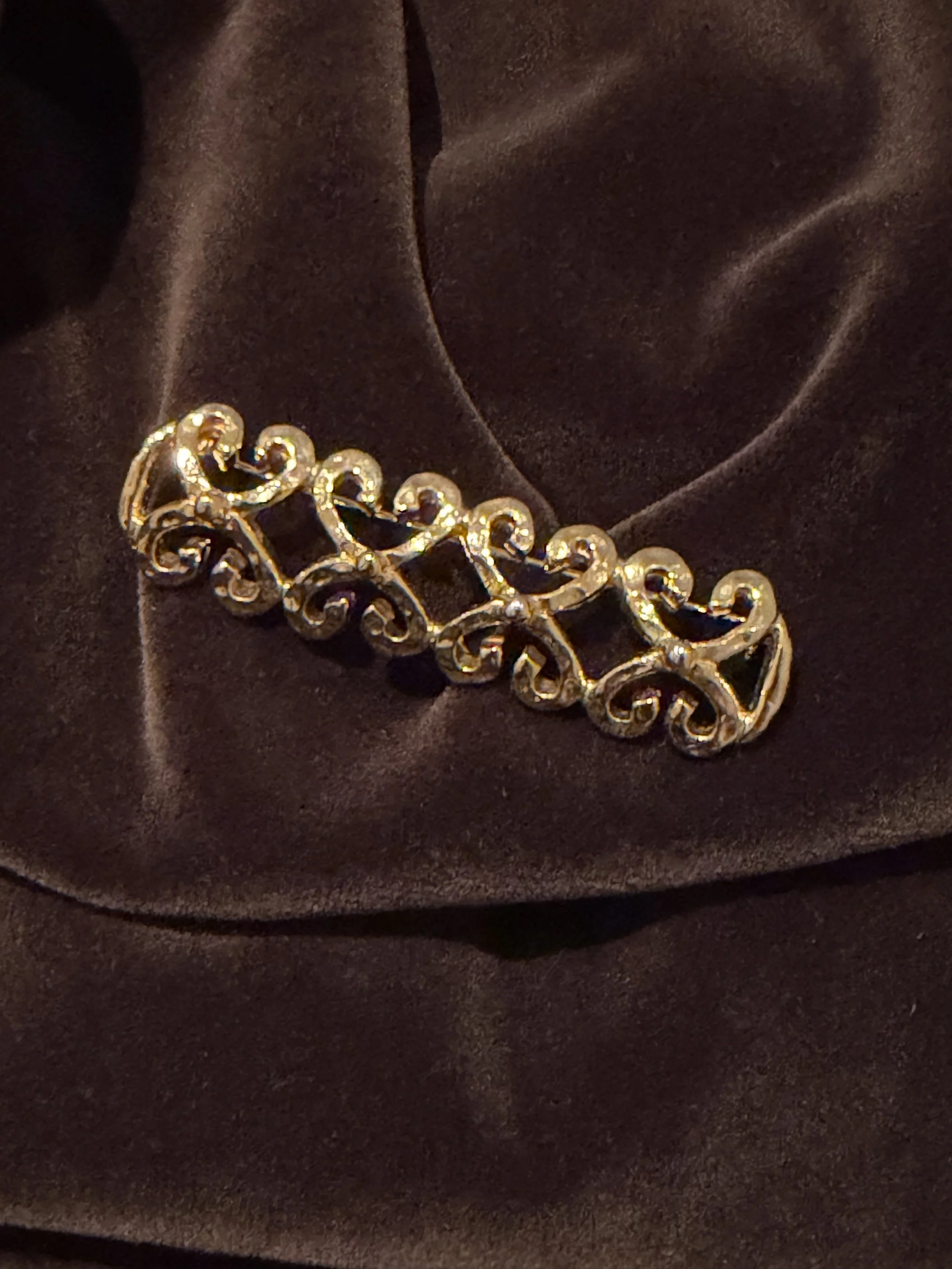 Gold coloured bar brooch