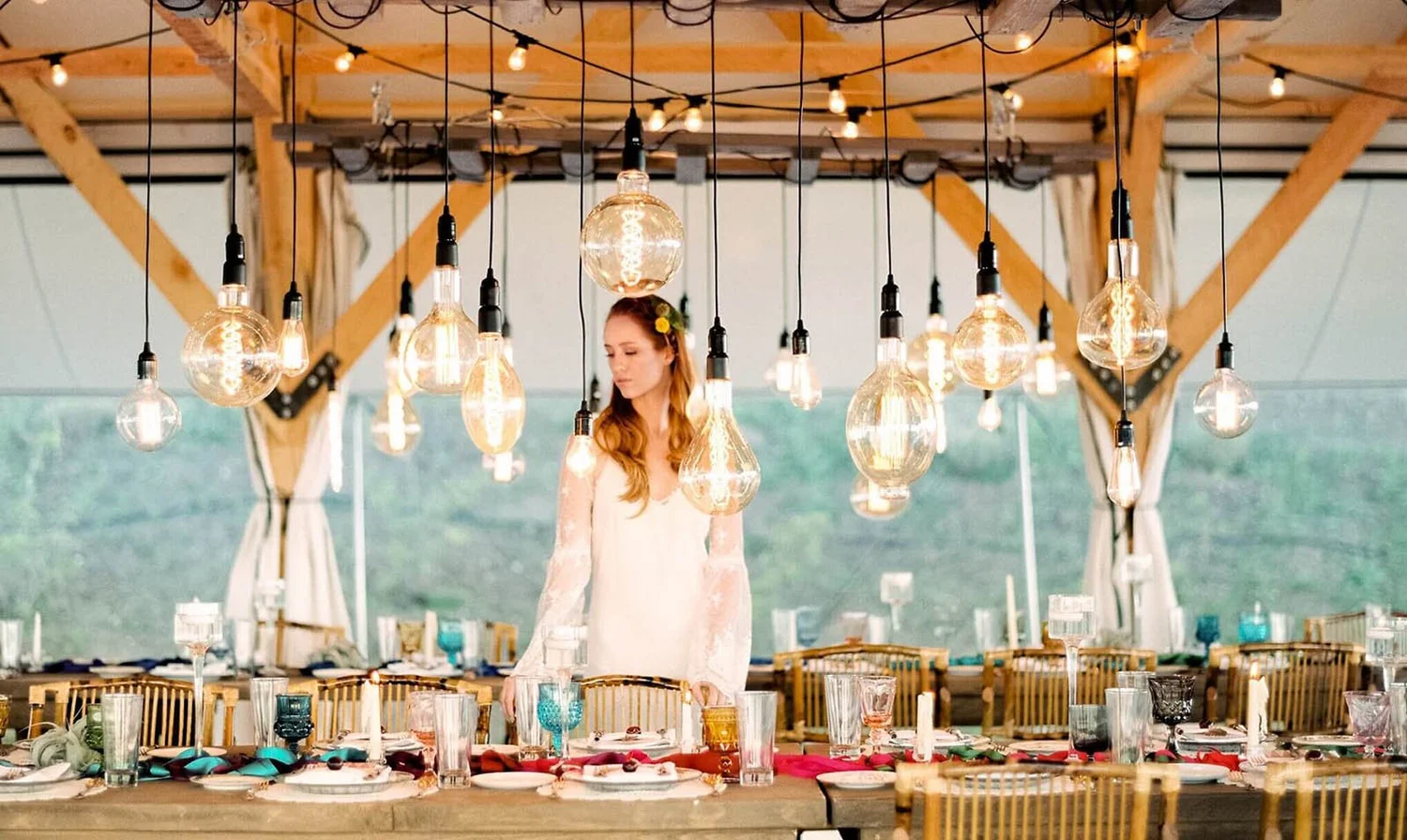 Rows of Conestoga Ranch glamping tents set against the Bear Lake landscape