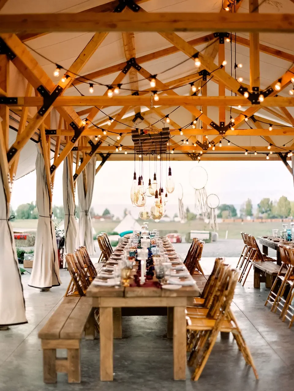 Wide scenic view of Conestoga Ranch beside bright blue Bear Lake