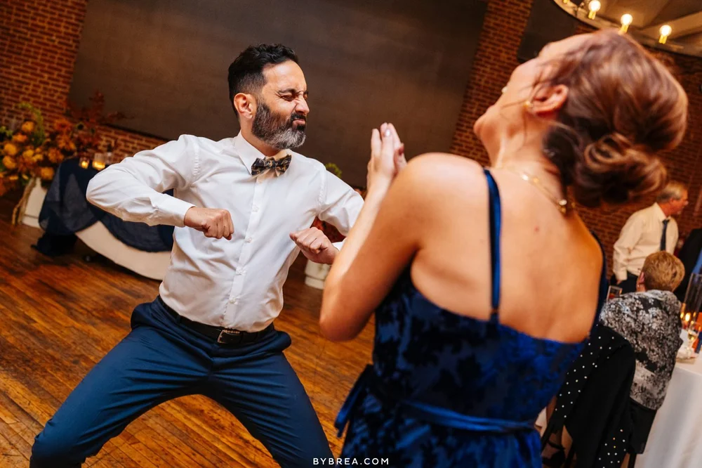 Two guests dancing in Crown Hall