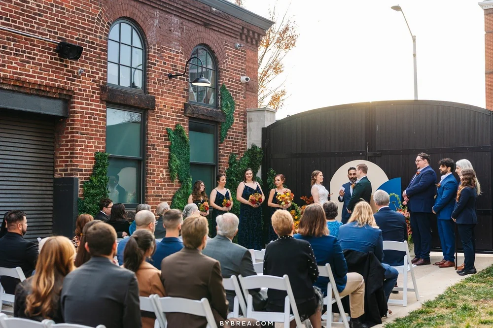 A garden ceremony at Guilford Hall, guests on white chairs