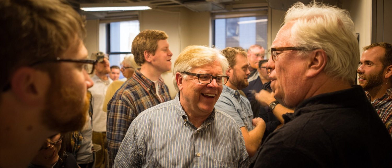 Professional team having a working lunch conversation at a restaurant private dining table