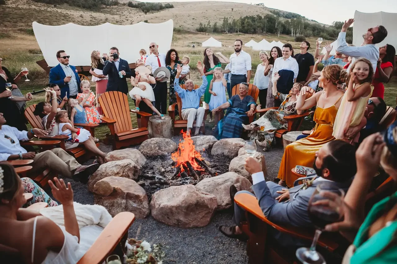 Corporate retreat group gathered outdoors at Conestoga Ranch with Bear Lake and mountain views