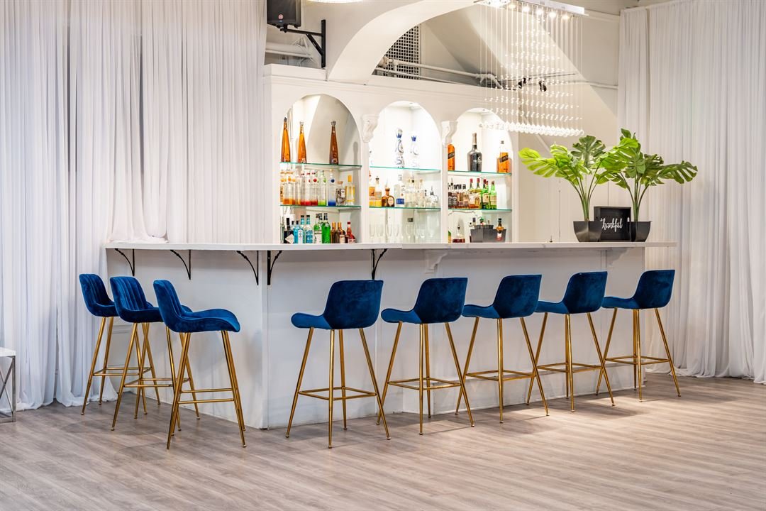 Dream SF bar with bottles displayed on glass shelves