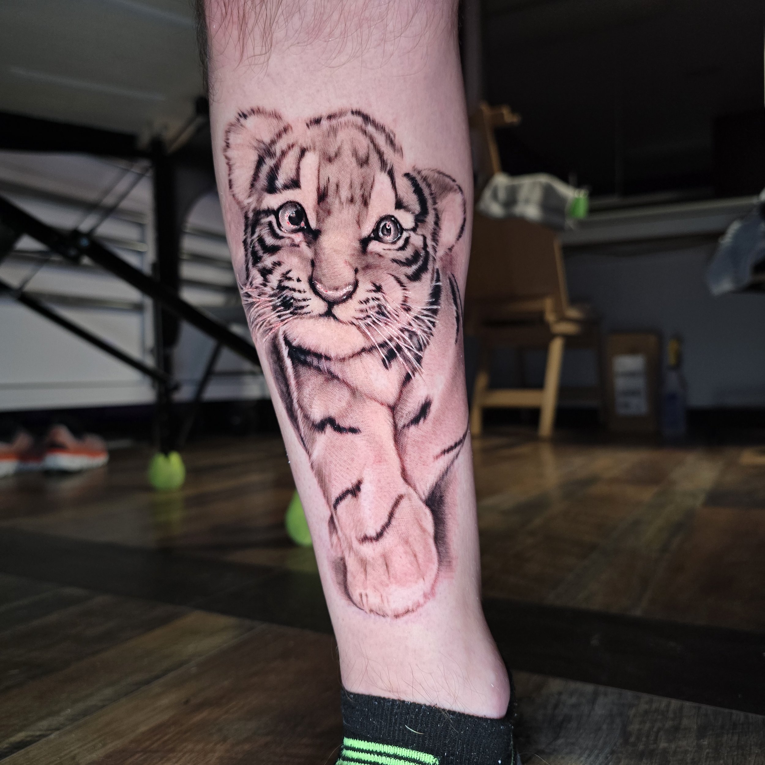 a special tattoo of a tiger cub to remind him of the stuffed animal he had as a child