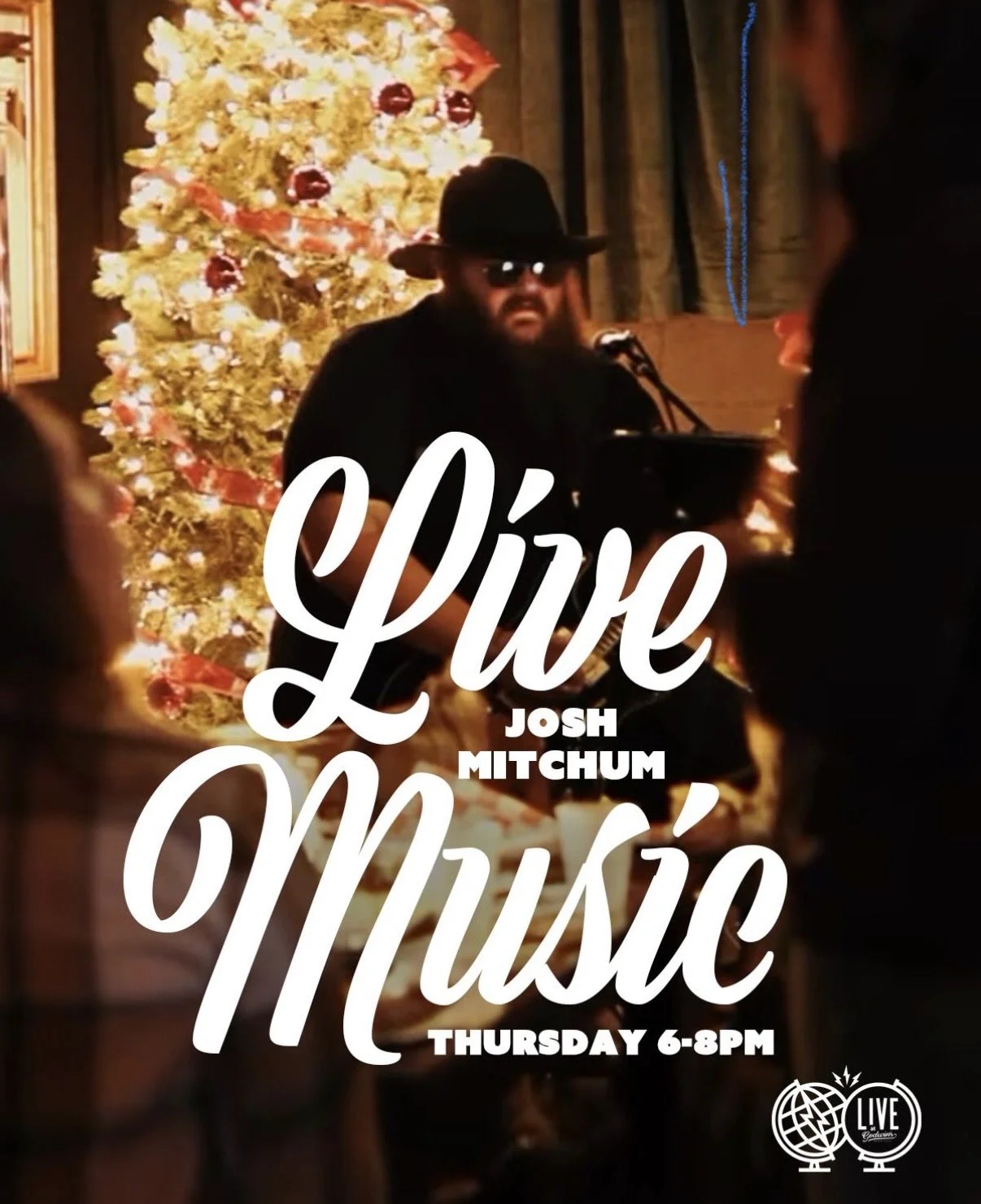 A musician with a hat and sunglasses performs at a Christmas-themed event with a decorated tree, in front of an audience, promotional poster for Live Music featuring Josh Mitchum, scheduled for Thursday from 6 to 8 PM.