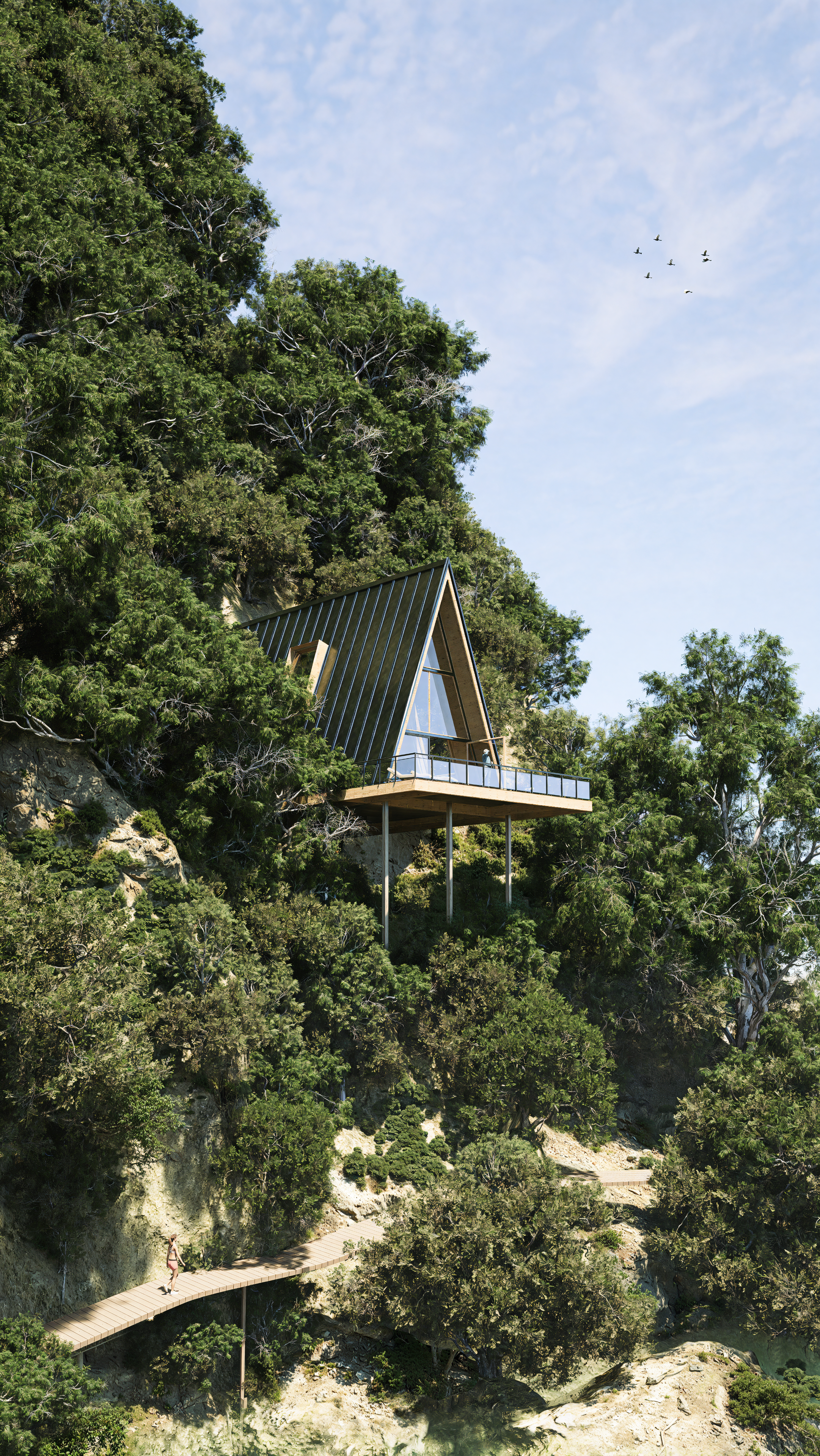 A modern A-frame house with large windows and a balcony, built on stilts on a hillside surrounded by dense green trees, with a person walking on a wooden path below it.