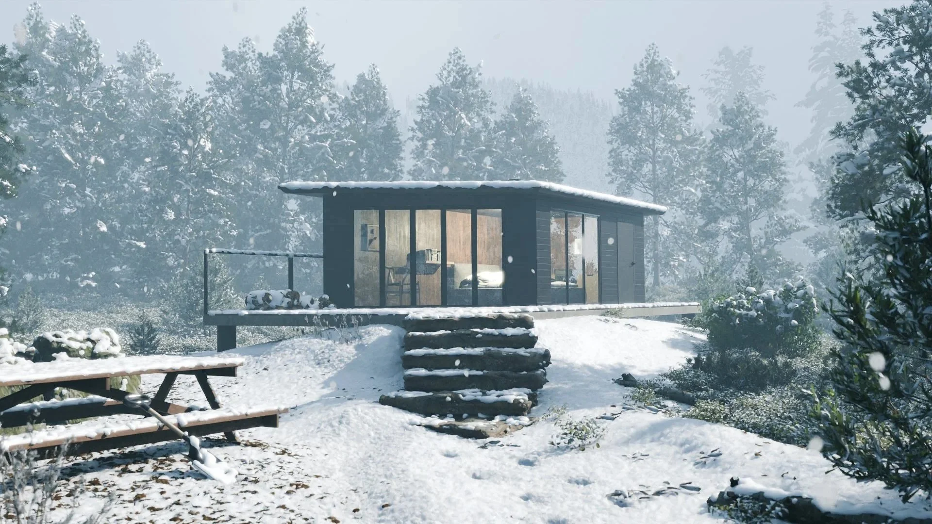 A modern cabin with large glass windows in a snowy forest landscape, with a picnic table in the foreground and snow-covered trees in the background.