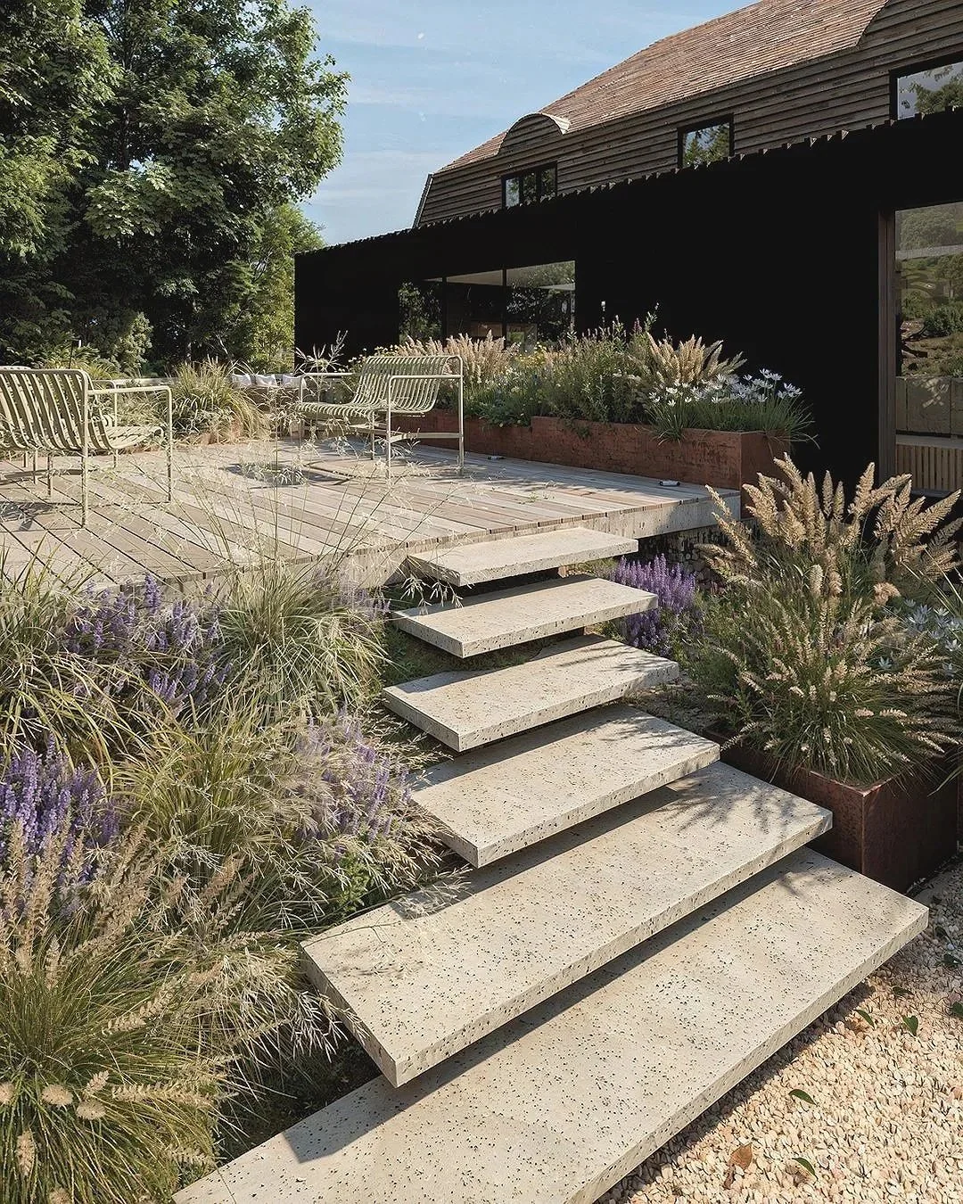 Modern garden design featuring floating concrete steps, a timber deck, and layered planting with lavender and ornamental grasses, captured in a contemporary outdoor living visualisation that blends clean architectural lines, natural textures, and min