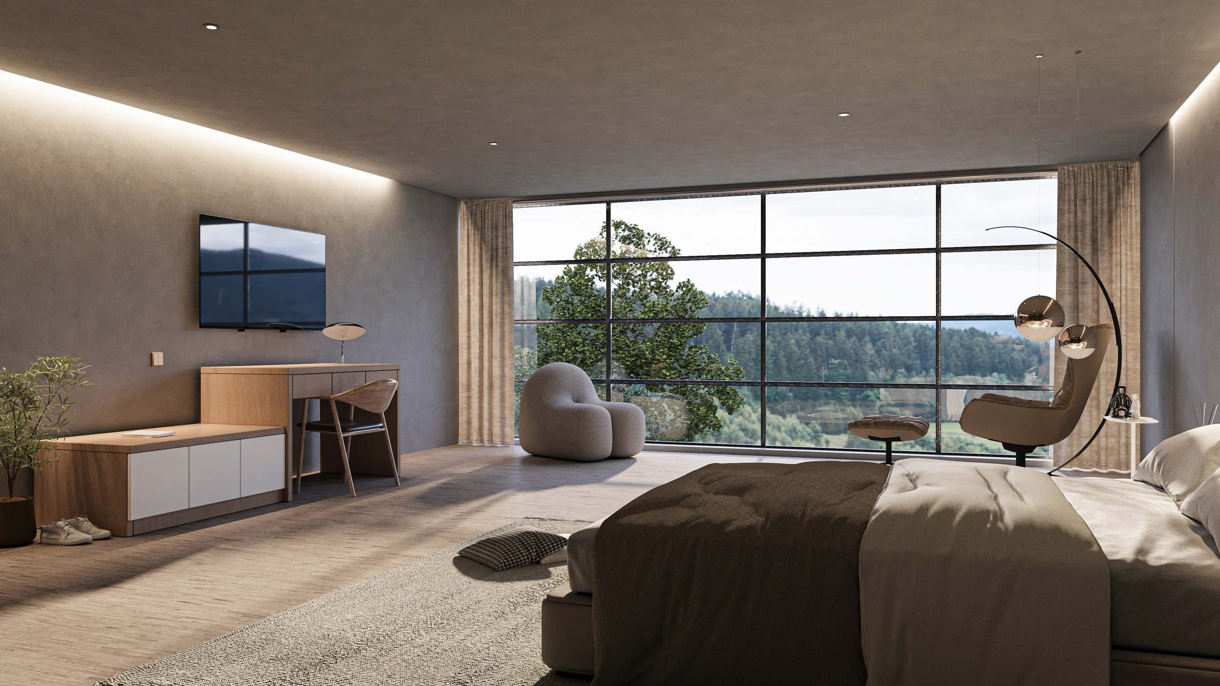 A modern bedroom with a large window showing a view of trees and hills. The room features a bed with dark bedding, a circular floor lamp with multiple metallic globes, a beige armchair, a small round ottoman, a desk with a chair, a wall-mounted TV, a