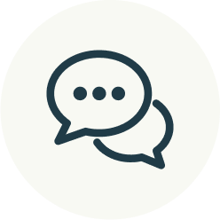 Icon of two overlapping speech bubbles, one with three dots.
