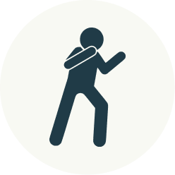 Icon of a person holding a phone and walking.