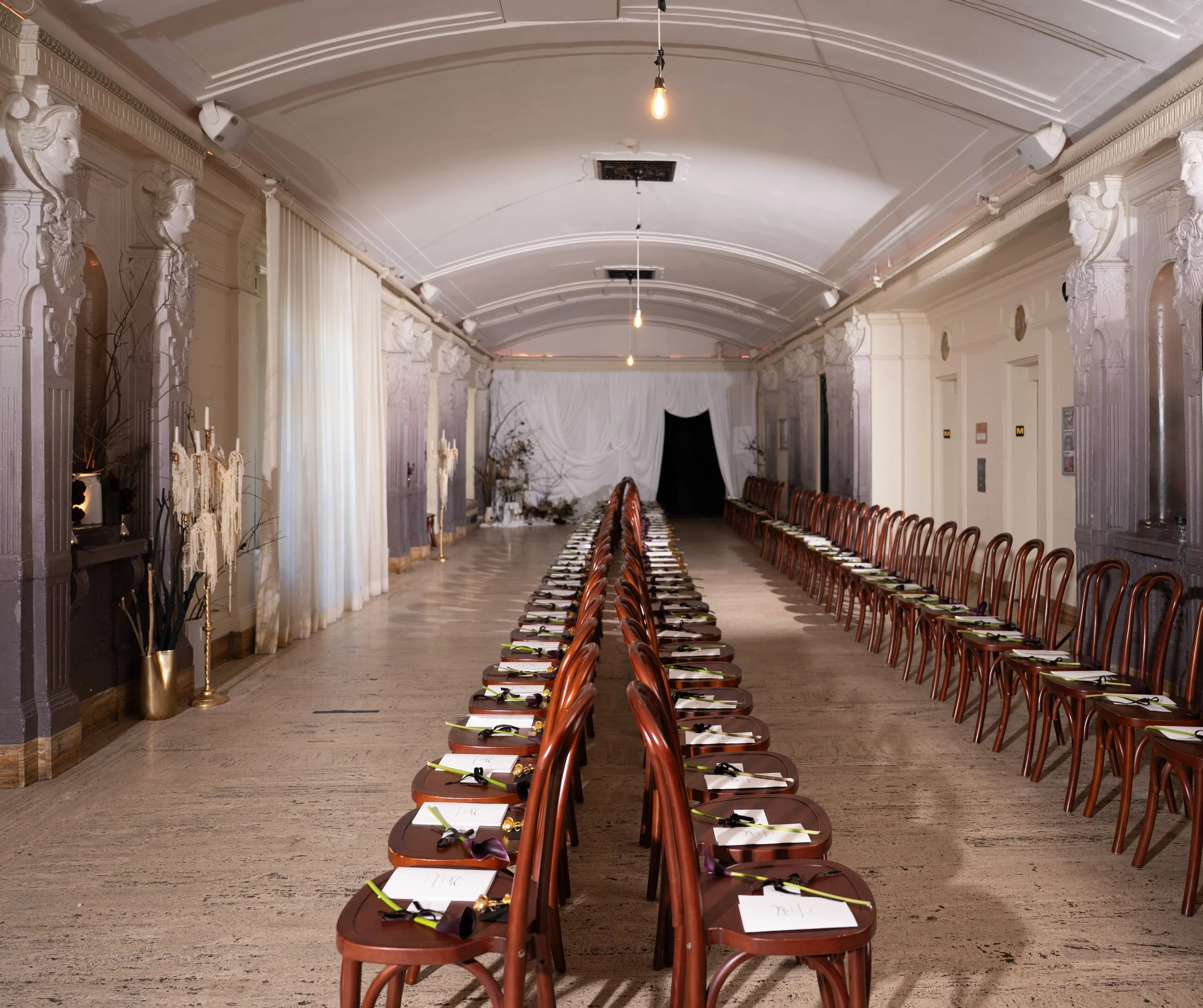 Runway and salon-style seating setup for Tang Chi Couture’s NYFW SS27 show at Freehand New York.