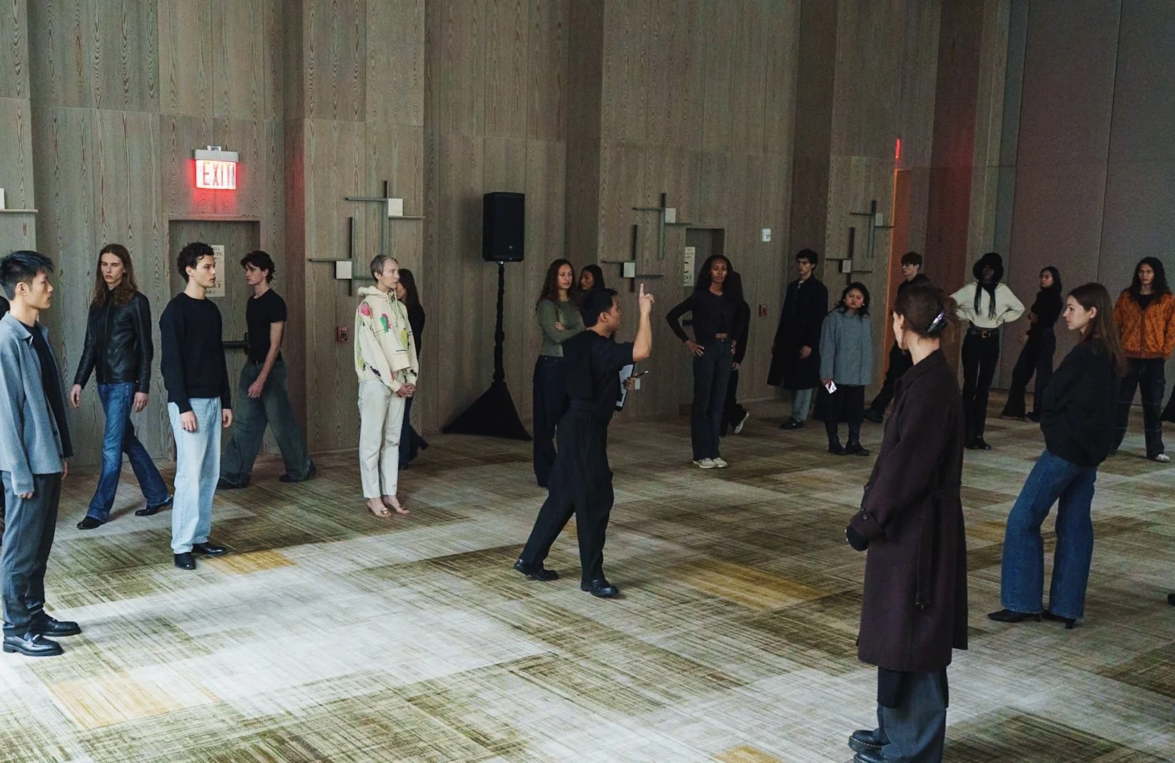 Models arranged in circular inner formation with outer curved layer during Veejay Floresca NYFW FW26 presentation