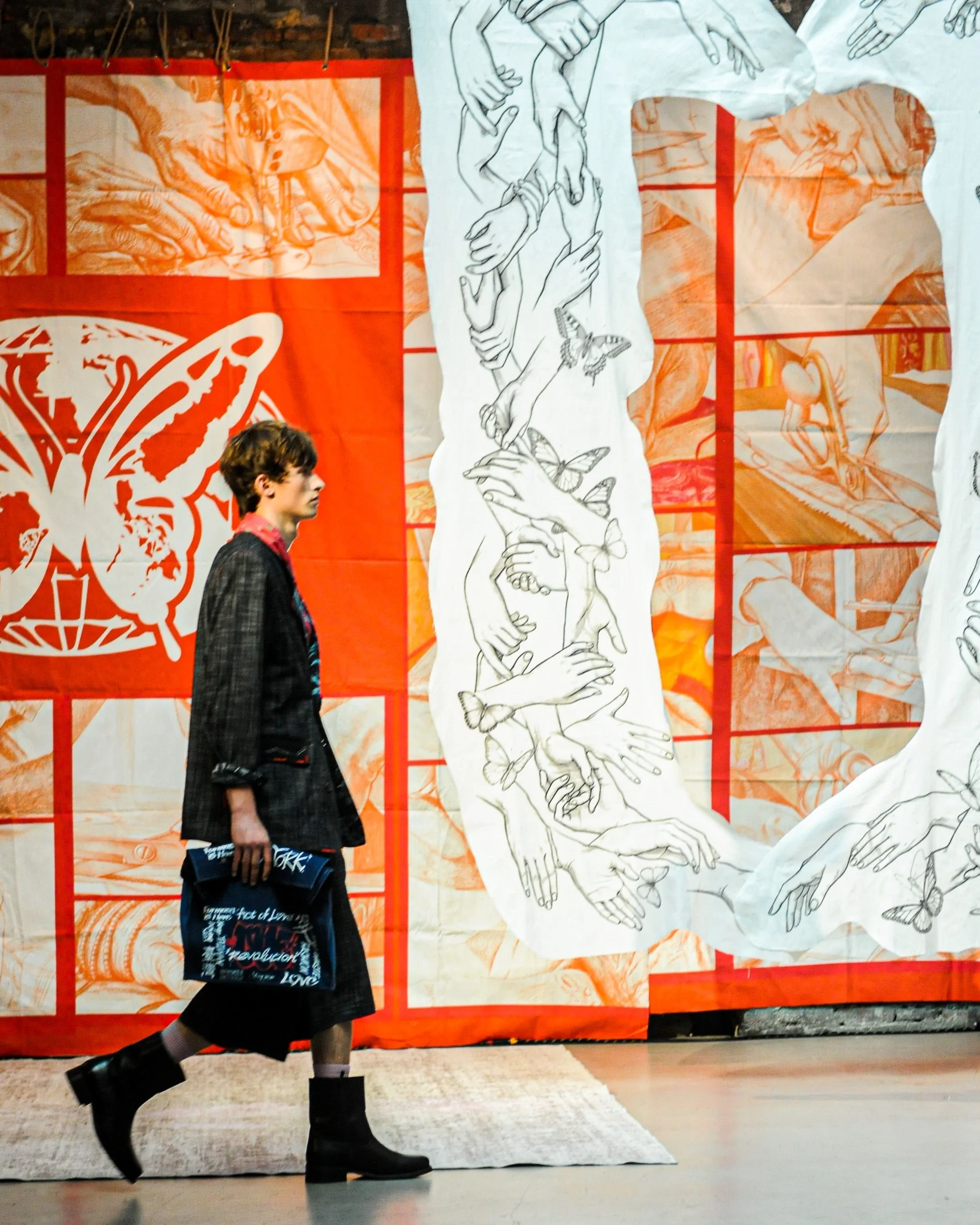 Model walking through Story Wear’s SS27 NYFW presentation produced by 3rd Space Productions at Ideal Glass Studios.