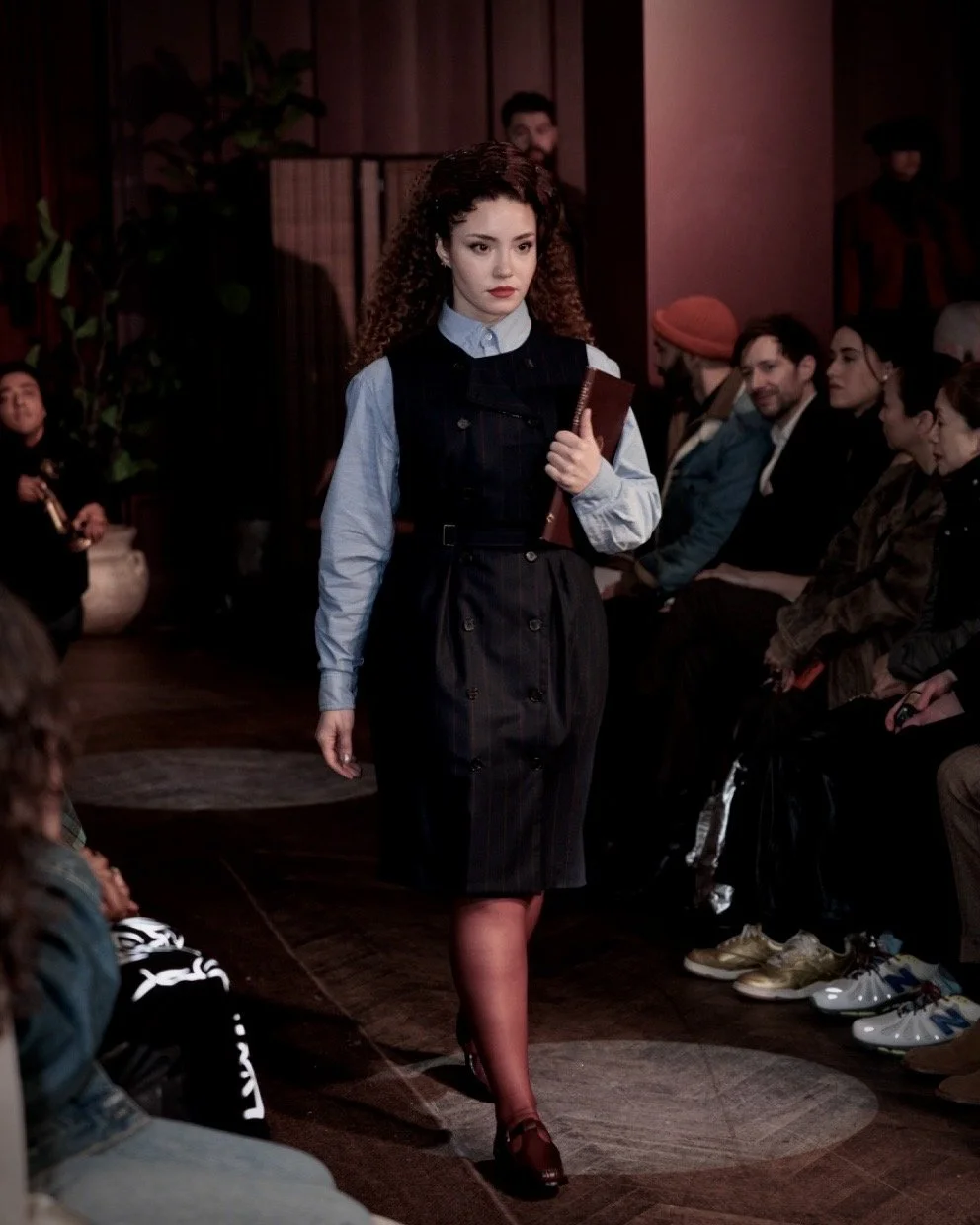 Model walking runway at Jack Sivan NYFW 2026 show under red ambient lighting inside Freehand New York venue