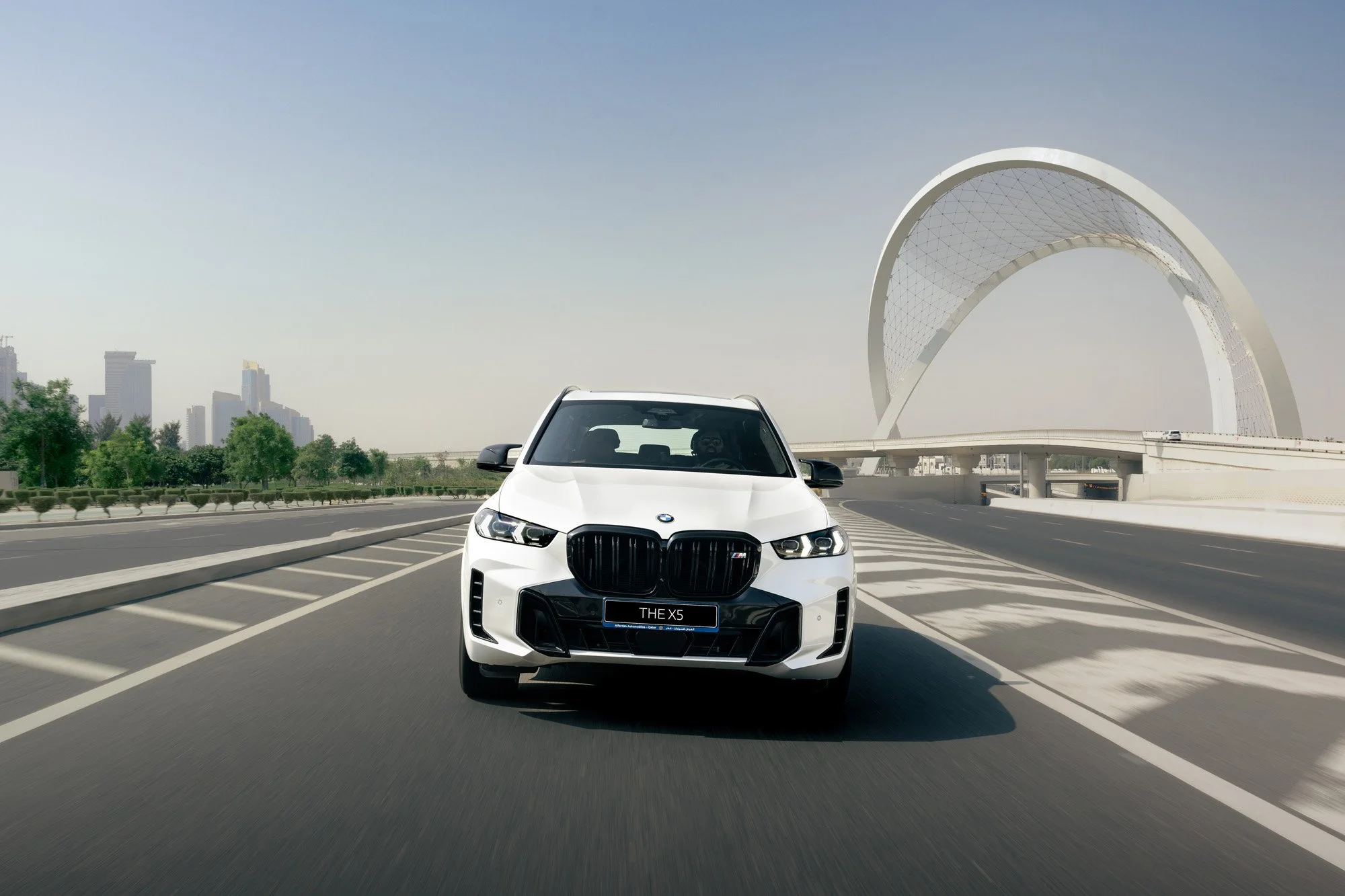 White BMW X5 M60i in West Bay Doha, Qatar. Photography by Talha Belal.