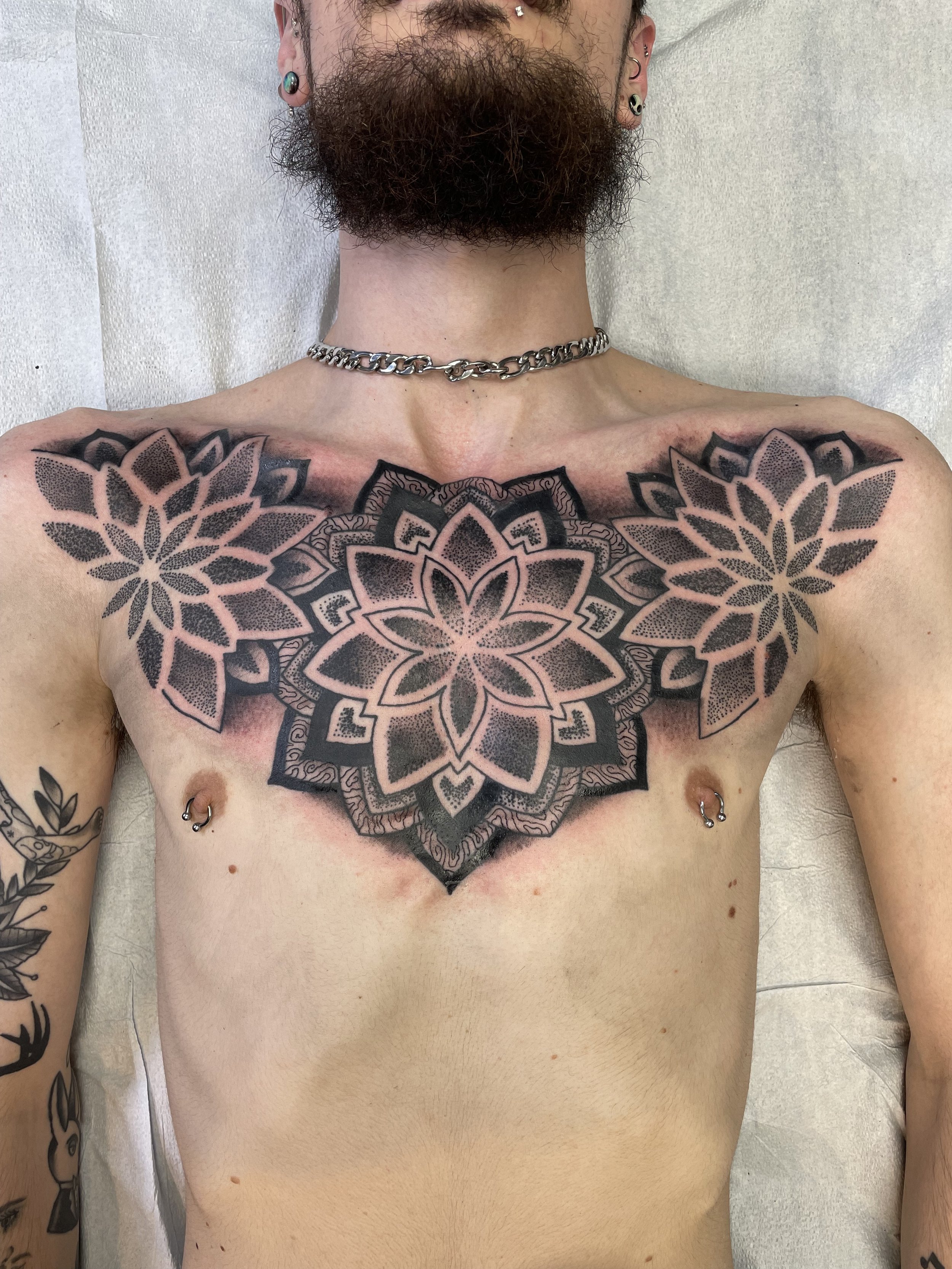 hunter_sacred_geometry_chestpiece_tattoo.jpeg