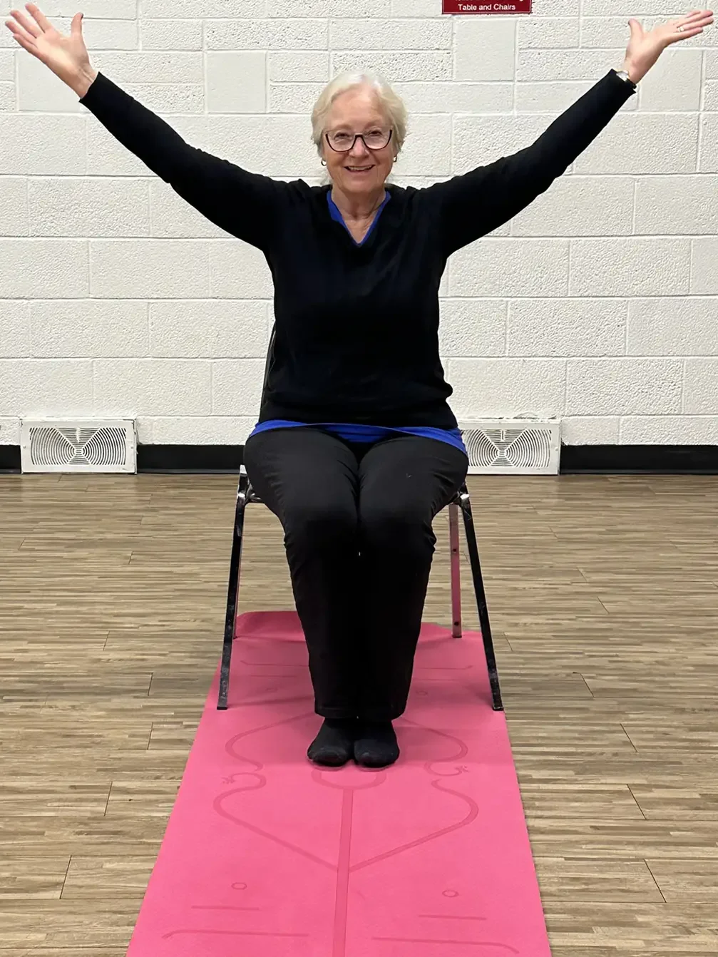 A senior having fun exercising at the Cosmo Senior Centre.