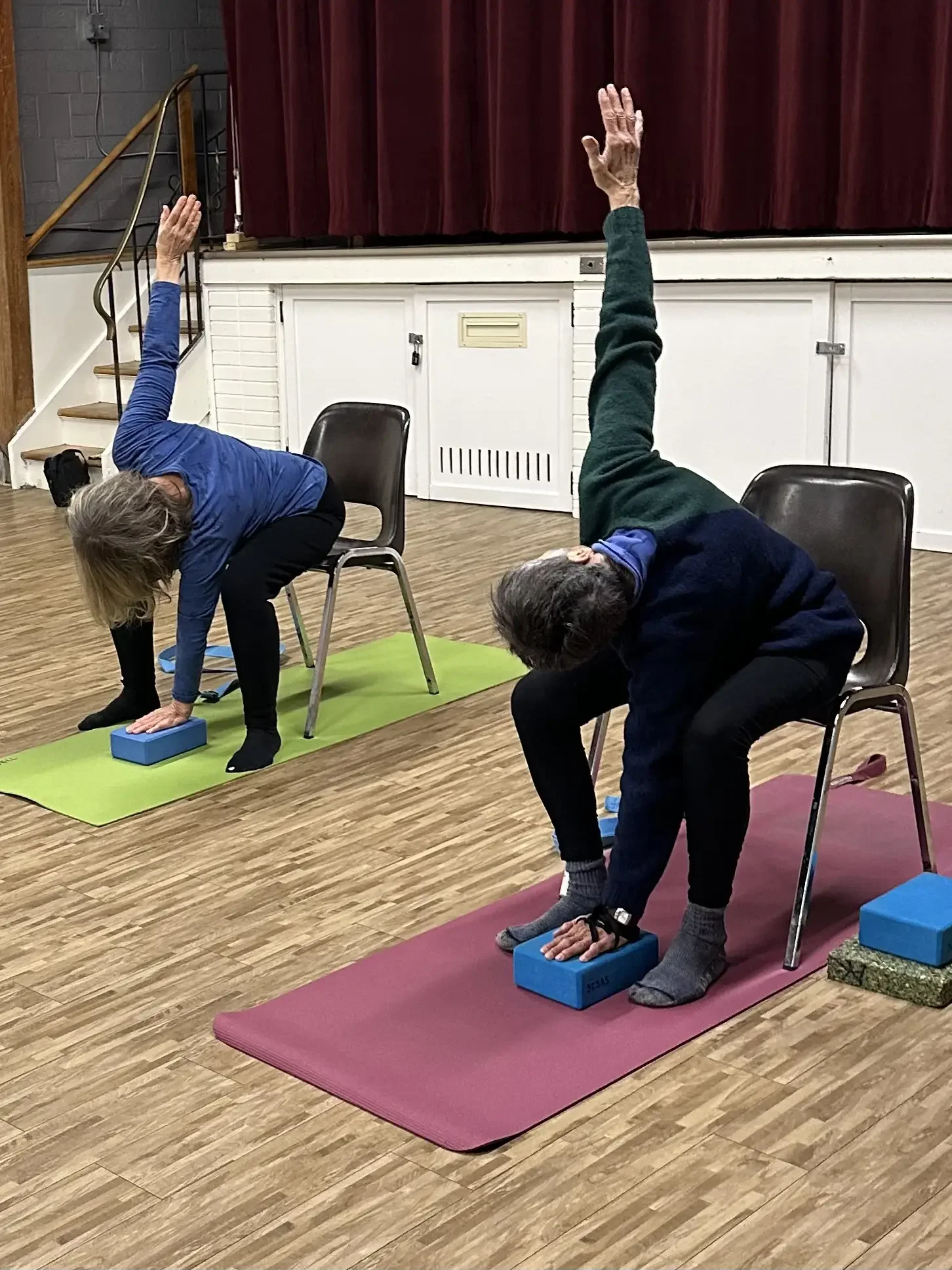 Seniors doing chair yoga at the Cosmo Seniors Centre.