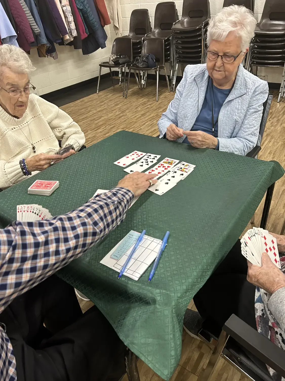 Seniors engrossed in playing the card game "bridge" at the Cosmo Senior Centre.