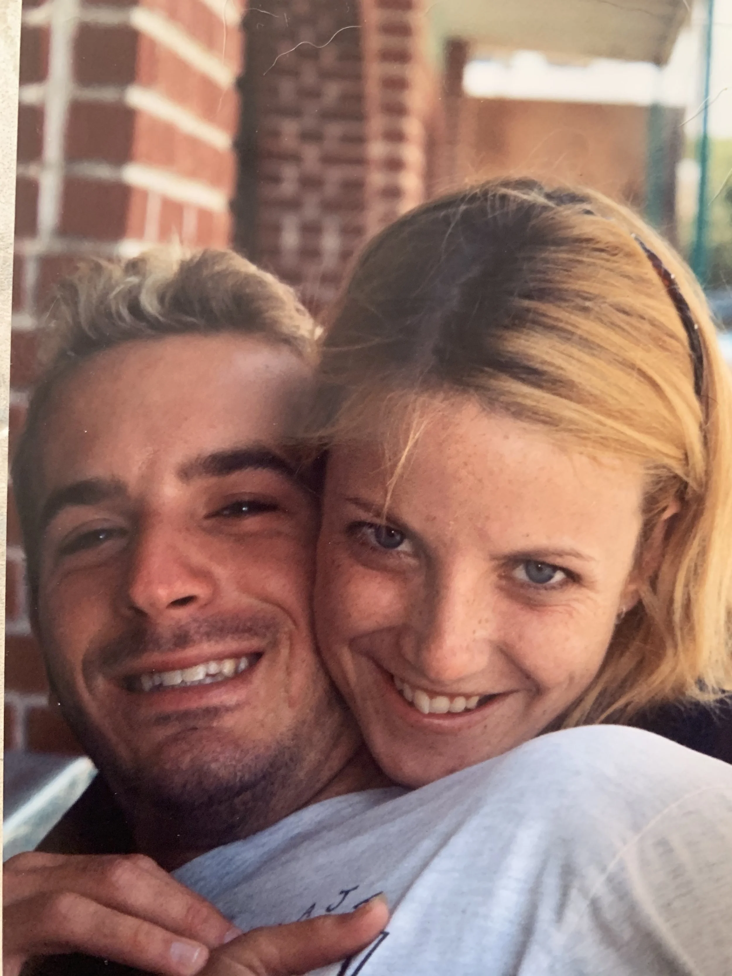 Young picture of Marie and Adam Hill locked in embrace