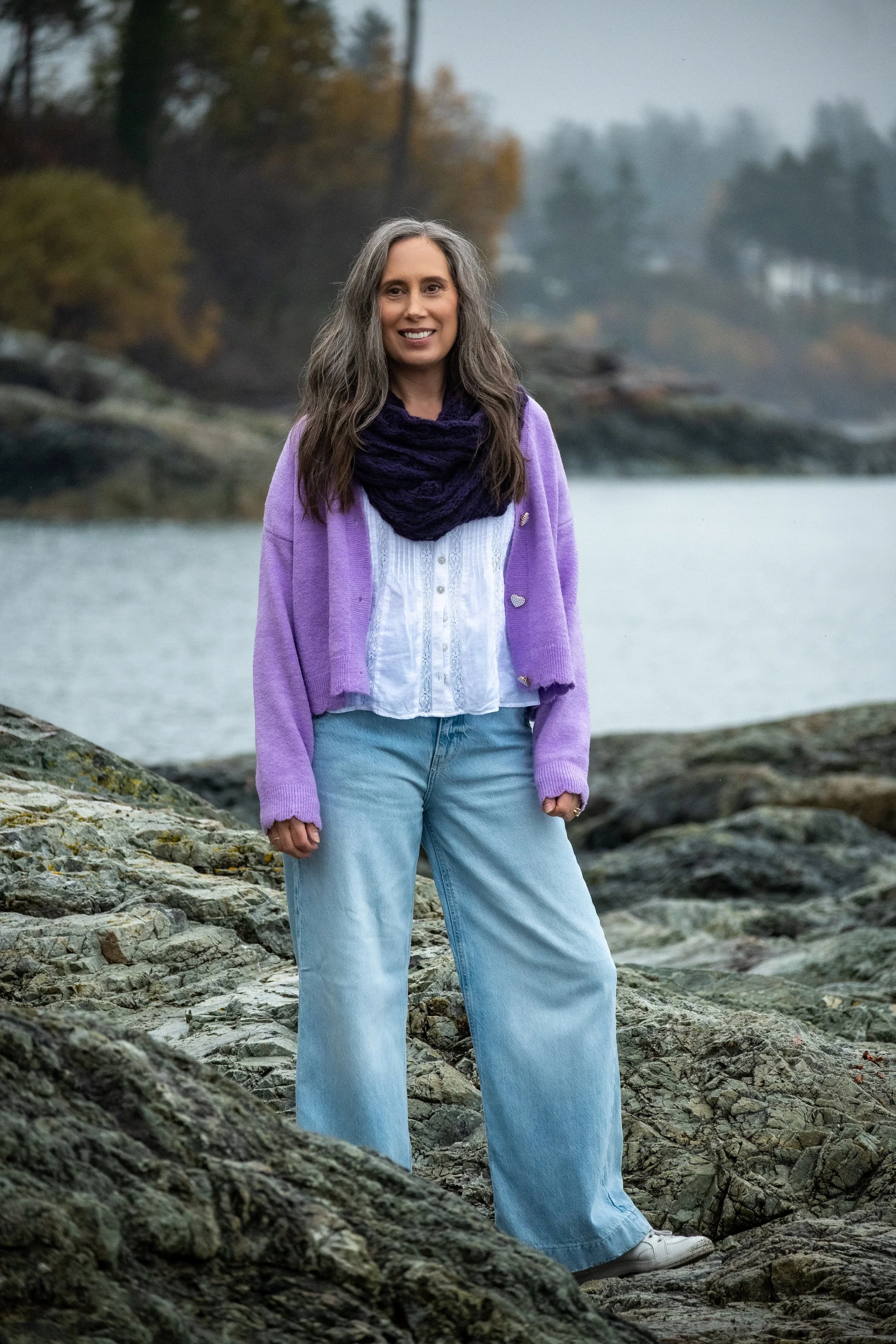 Cynthia Solylo-Kennedy somatic experiencing therapist in Victoria BC, standing on the beach.