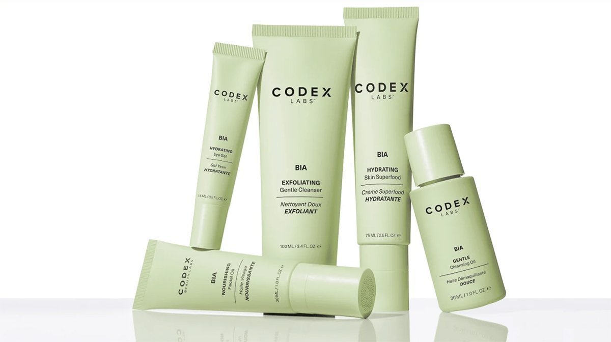 Collection of green skincare products from Codex Labs, including eye gel, gentle cleanser, skin superfood, nourishing moisturizer, and cleansing oil with minimalist packaging.