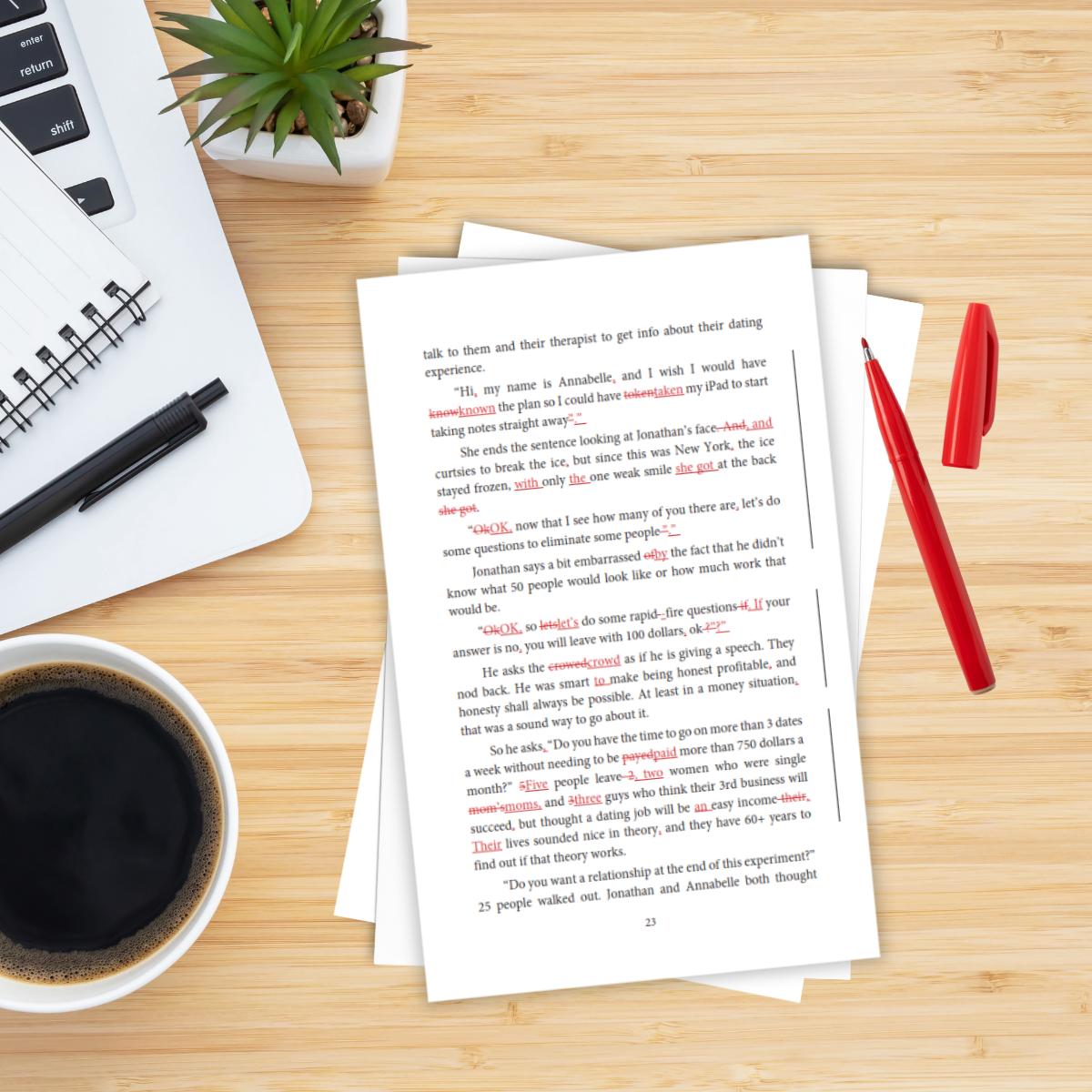 A wooden desk with a cup of black coffee, a stack of white papers with red corrections, a red pen, a closed red cap, a black pen, a notebook, a potted succulent plant, and part of a white keyboard.