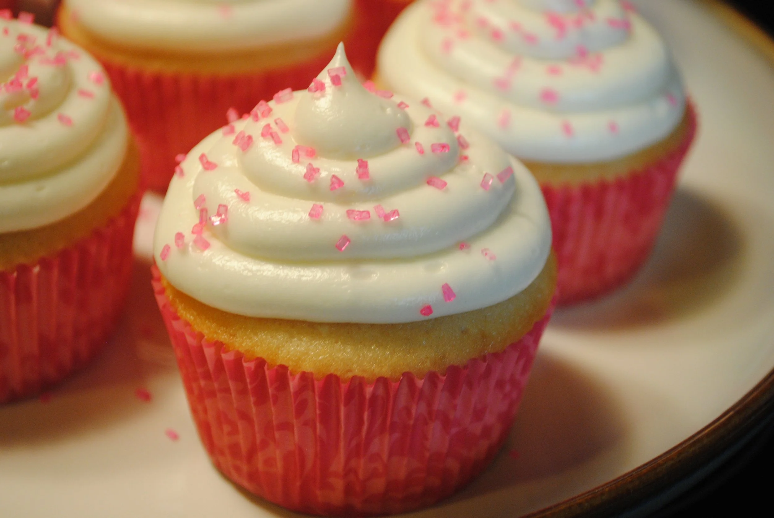 Raspberry Filled Vanilla Cupcakes with Cream Cheese Icing