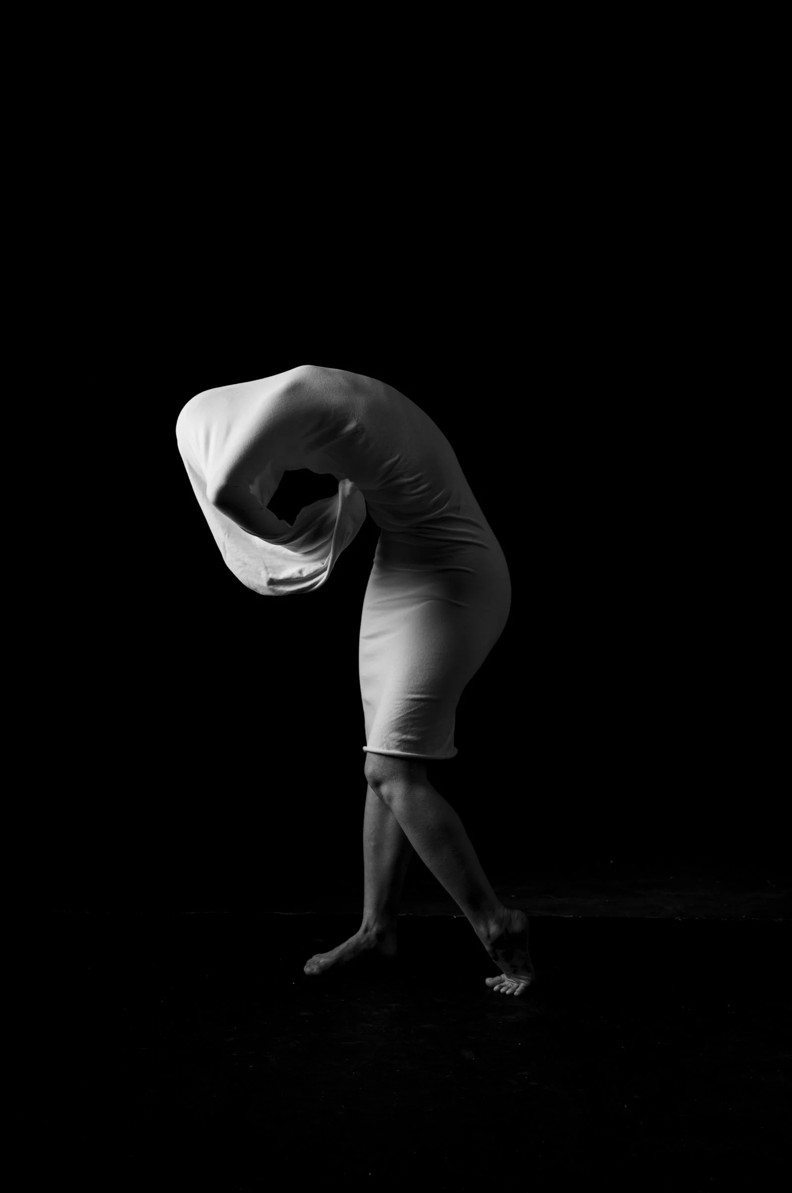 Minimalist photography exploring the abstract geometry and symmetry of the human body.