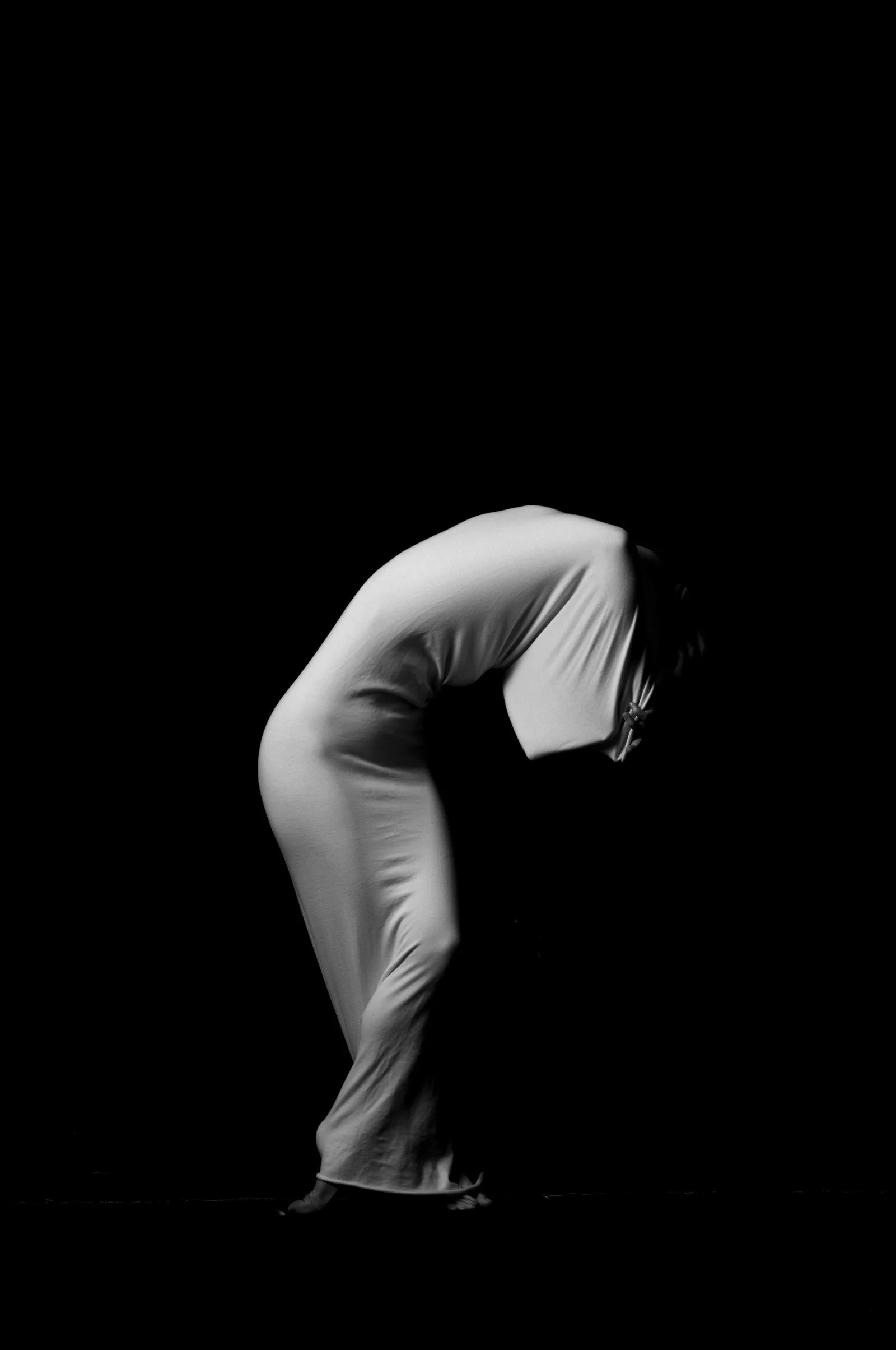 Sculptural portrait capturing a dynamic and complex form through a minimalist lens.