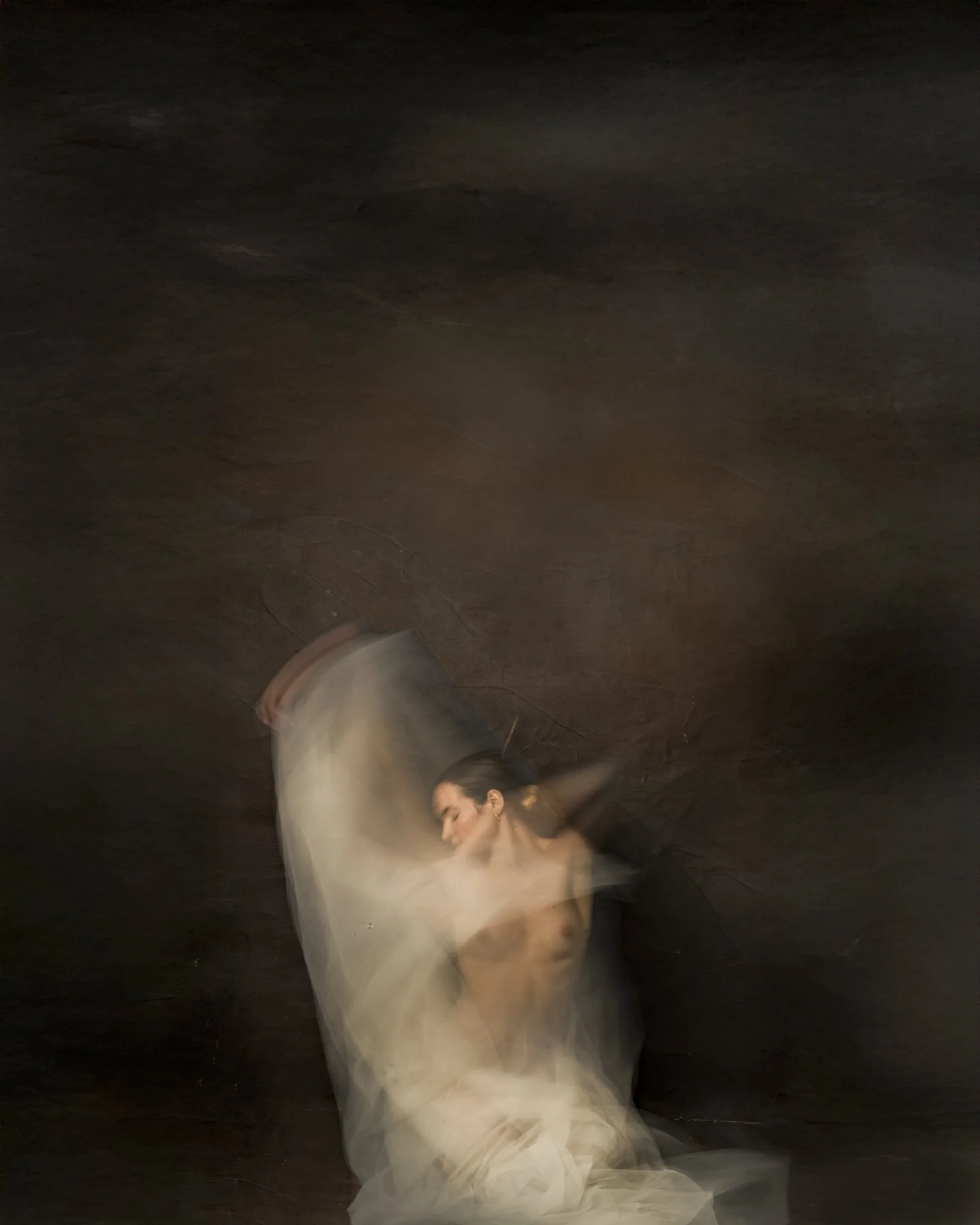 Chiaroscuro painterly portrait featuring dramatic light and shadows with artistic motion blur.