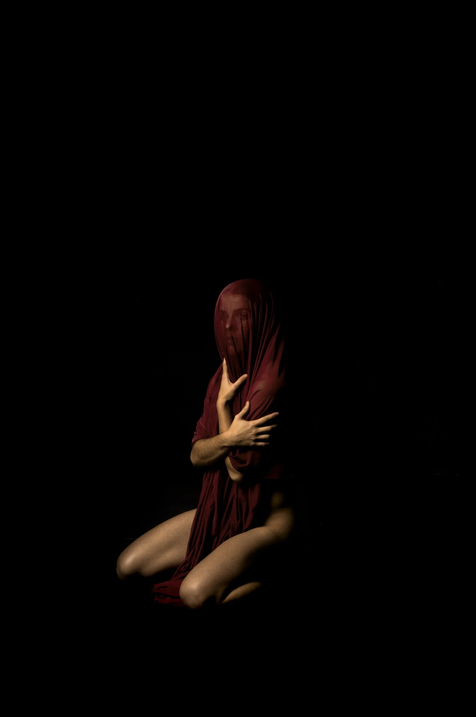 Evocative fine art photograph exploring the tension between light and dark.