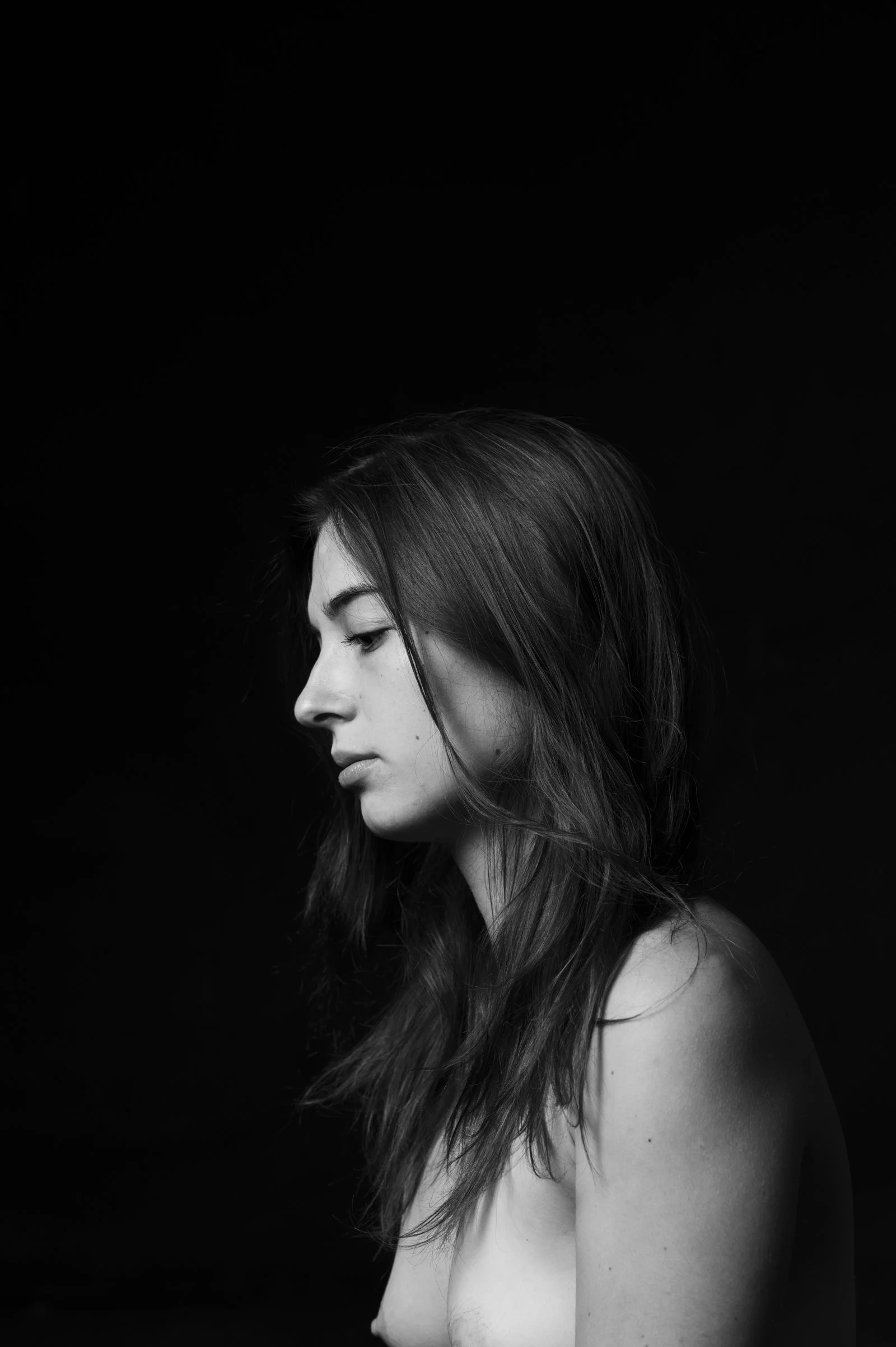 Minimalist study of a figure in deep shadow, part of the painterly People collection.