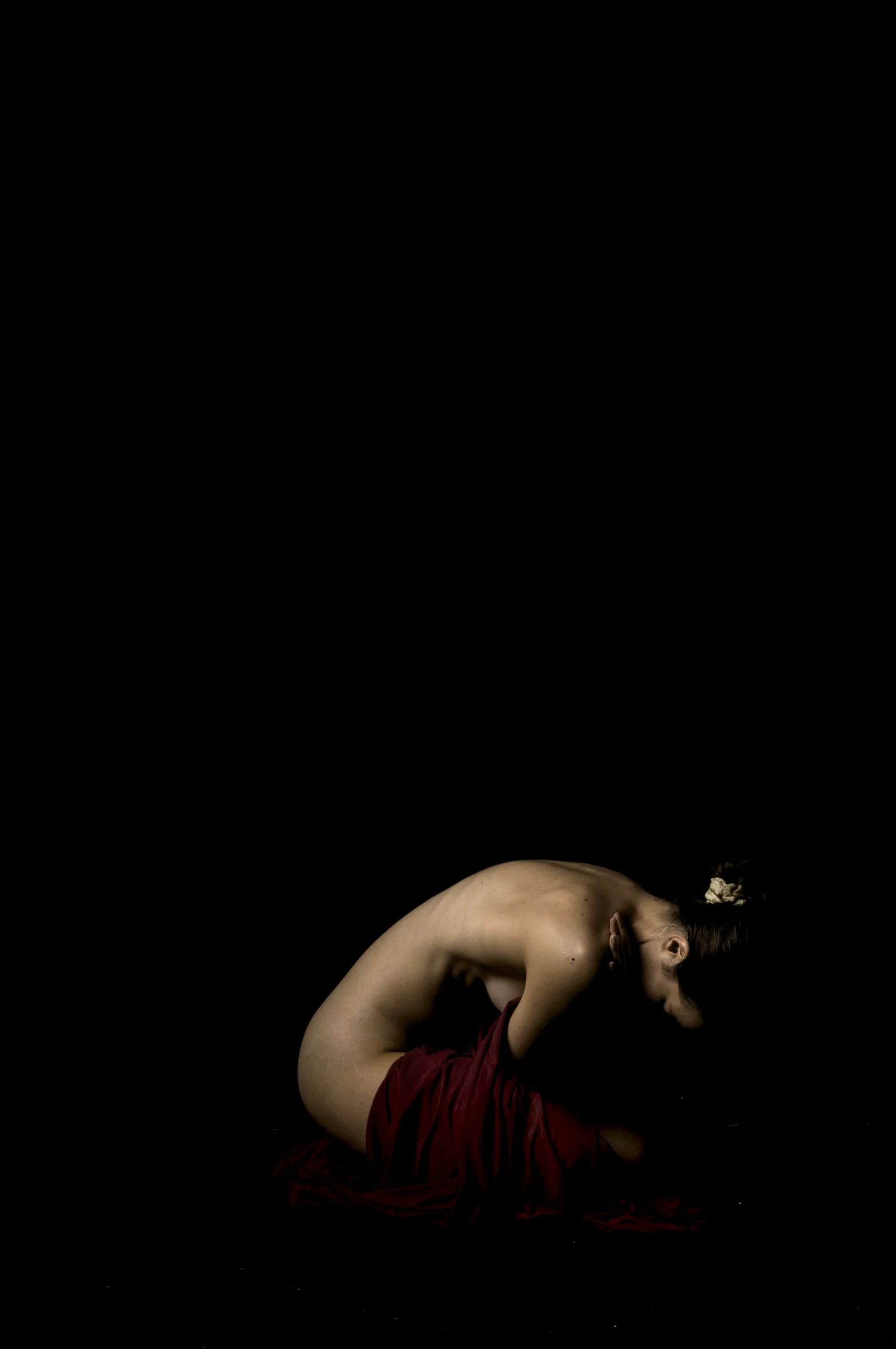 Deep shadows and warm highlights on a draped figure, Tension series master print.