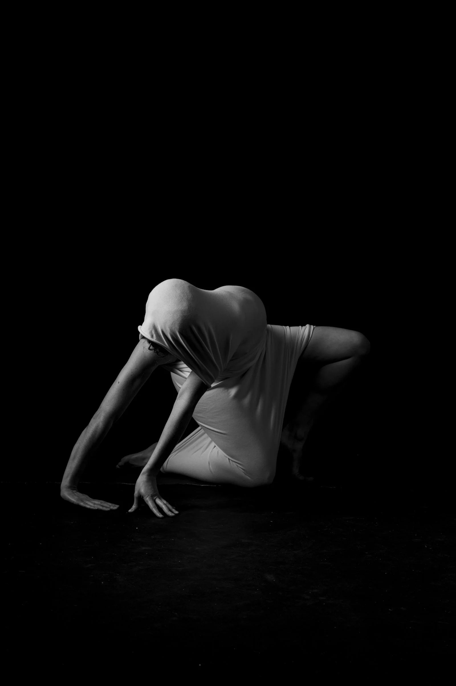 Abstract minimalist photograph focusing on the sculptural curves of the human form.