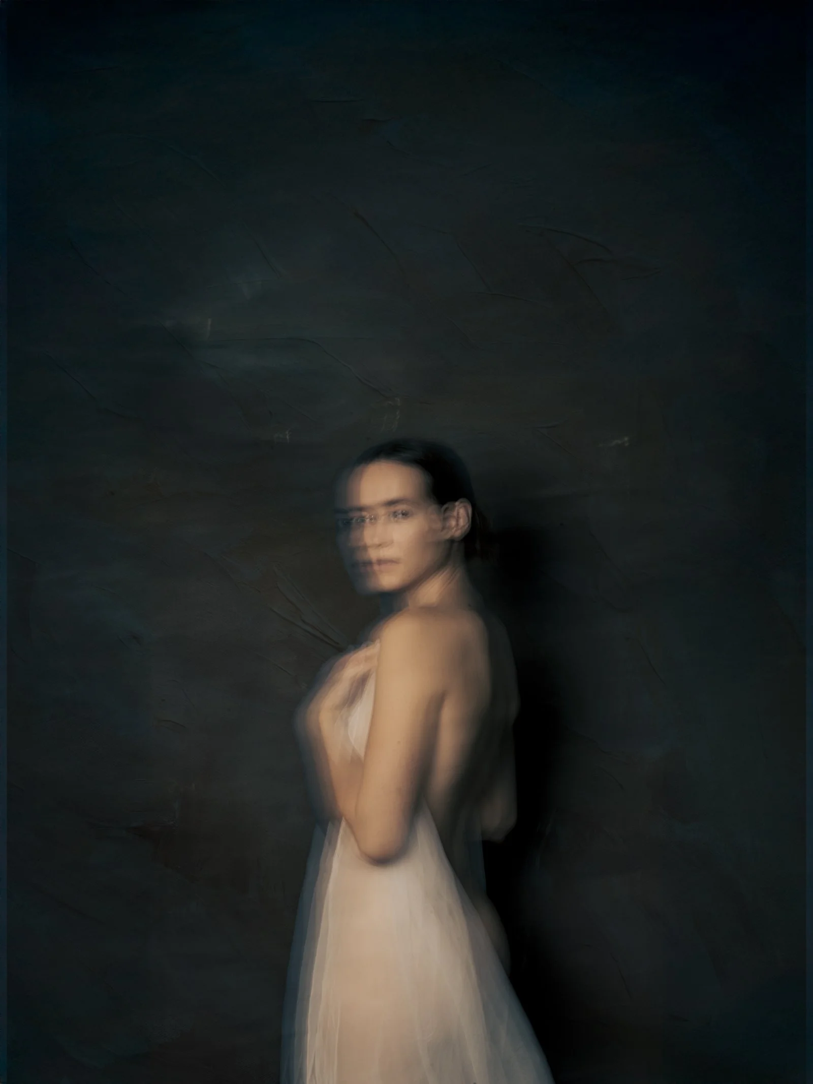 A painterly portrait created in-camera using slow shutter speeds to achieve soft, blended tones.