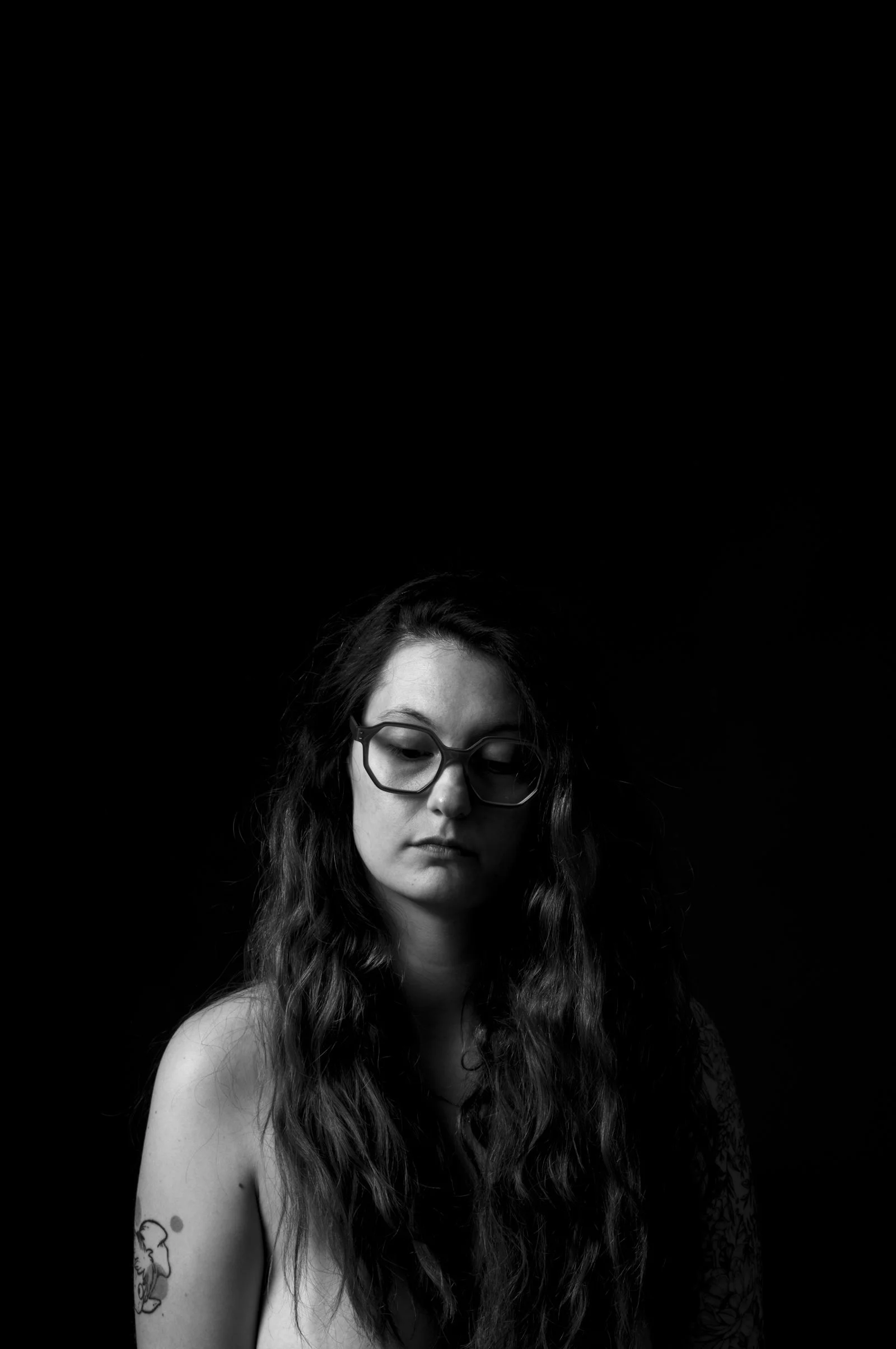 A person emerging from the canvas in a painterly, Renaissance-style portrait study.