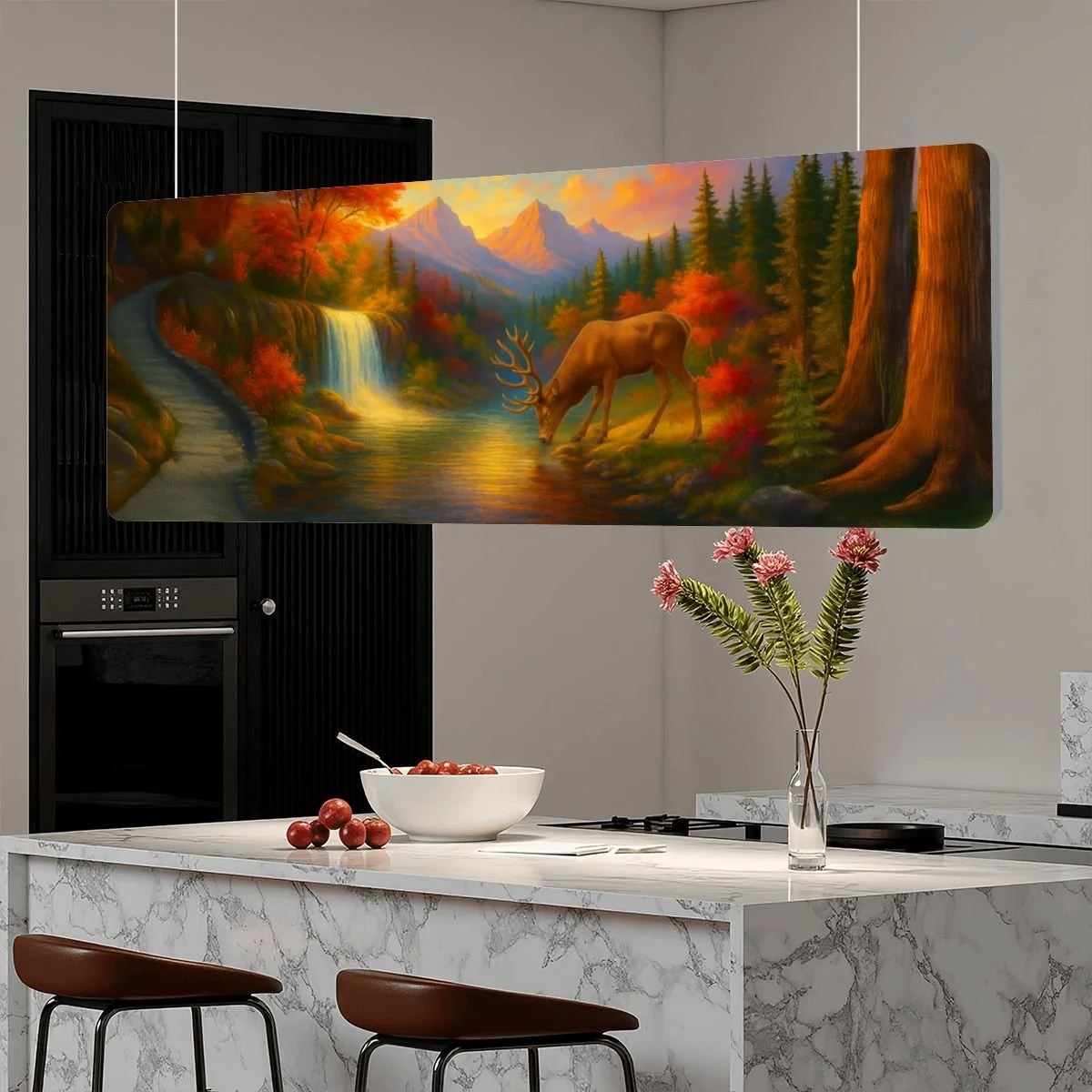 A large landscape painting of a forest scene with a waterfall, mountains, and a deer drinking water, hanging on a wall in a modern kitchen.