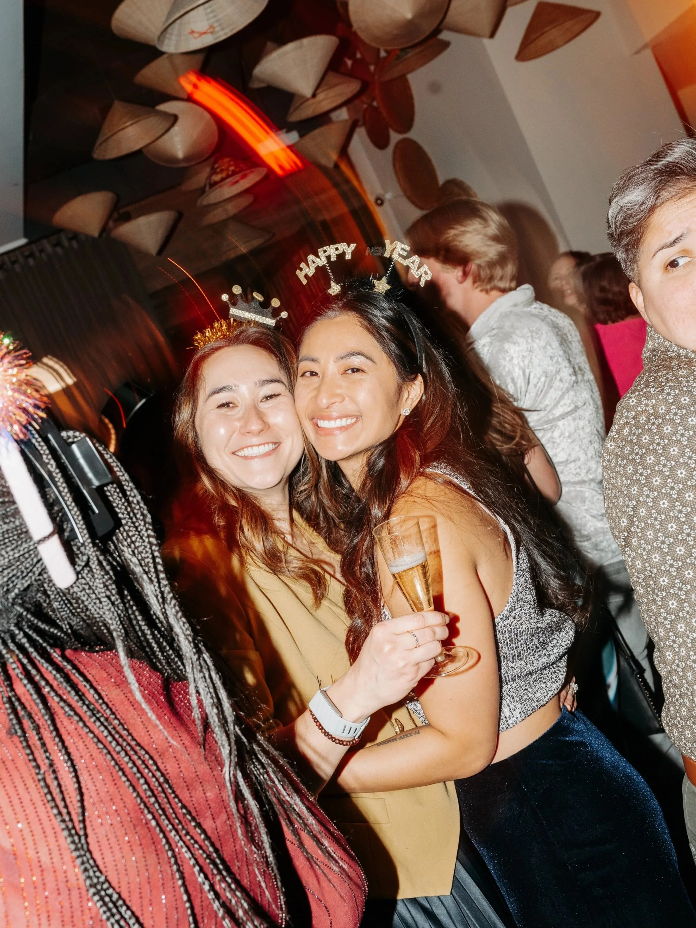 Two women celebrating New Year's Eve, wearing 'Happy New Year' headbands, smiling and holding champagne glasses.

Meredith Avery Photography, Memphis Event Photography, Memphis Event Photographer, Best Event Photographer, Best Memphis Event Photograp