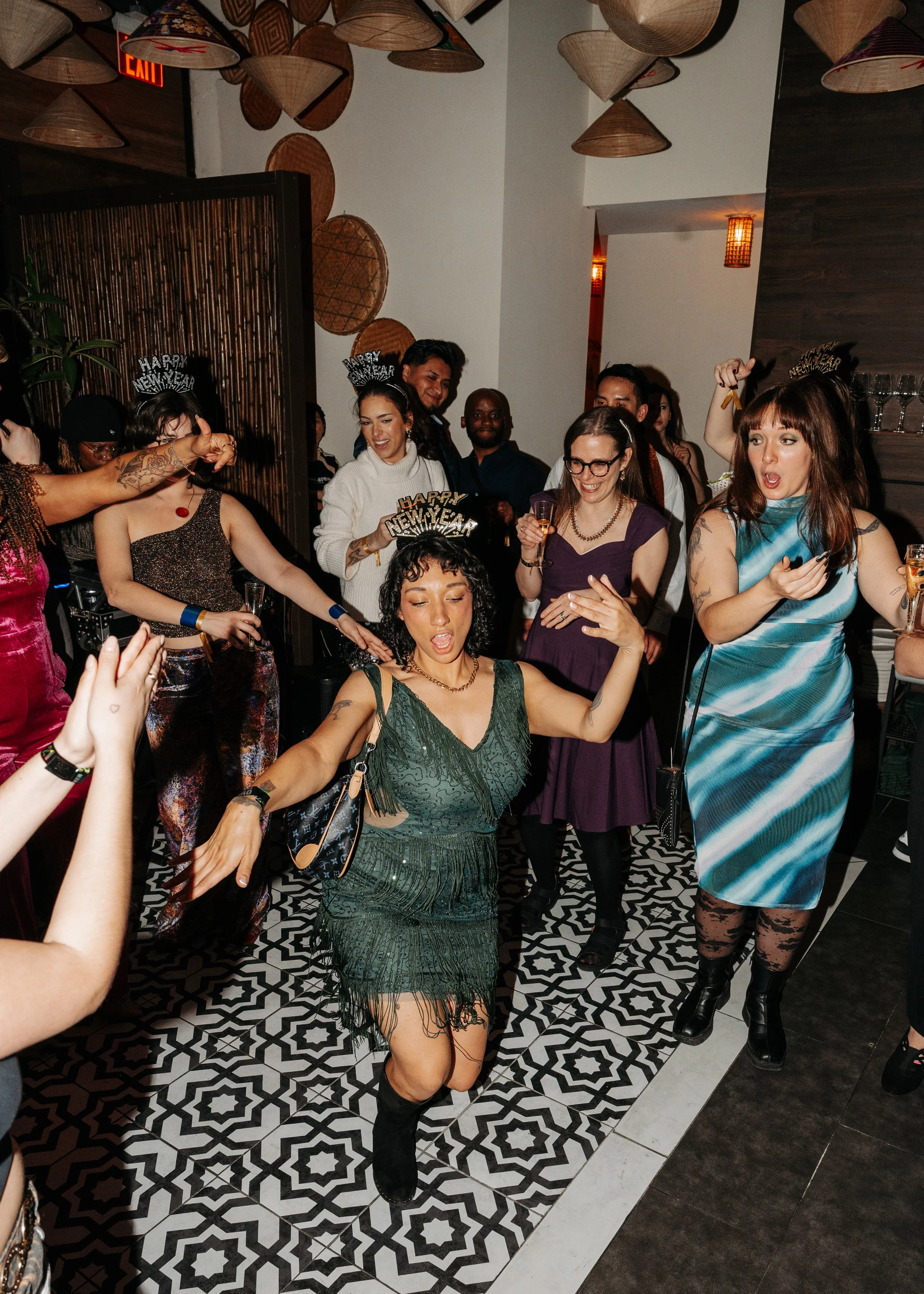 Group of people celebrating New Year's Eve at a party, with women wearing 'Happy New Year' headbands, dancing and enjoying drinks.

Meredith Avery Photography, Memphis Event Photography, Memphis Event Photographer, Best Event Photographer, Best Memph